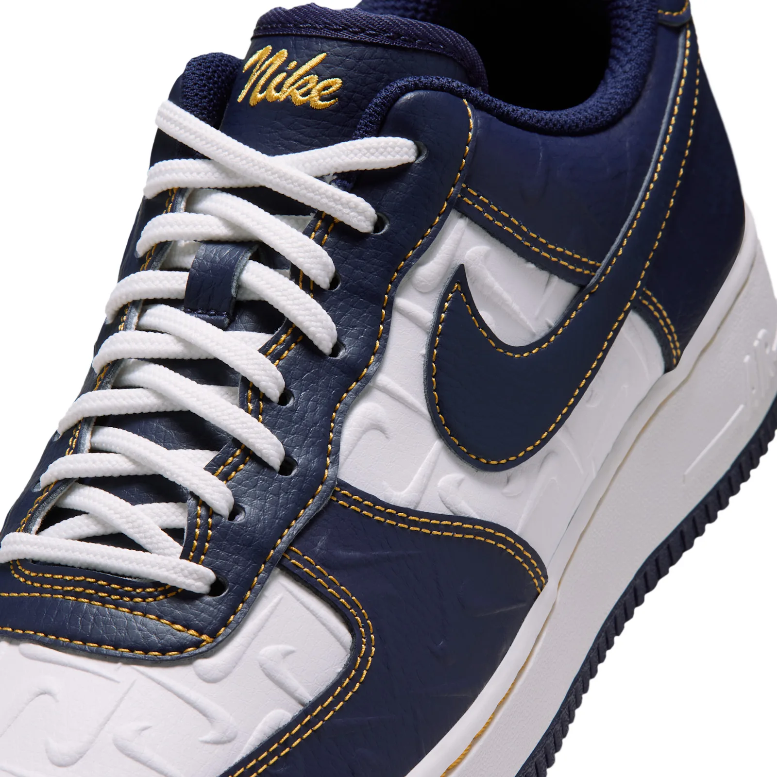 close-up toe detail, navy swoosh over embossed white vamp pattern, Low Mini Swoosh