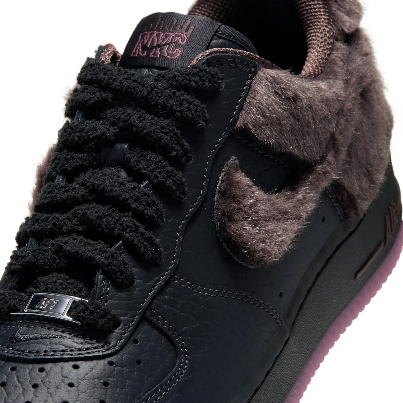 close-up of fur swoosh and chenille laces on black leather vamp, NYC Rat