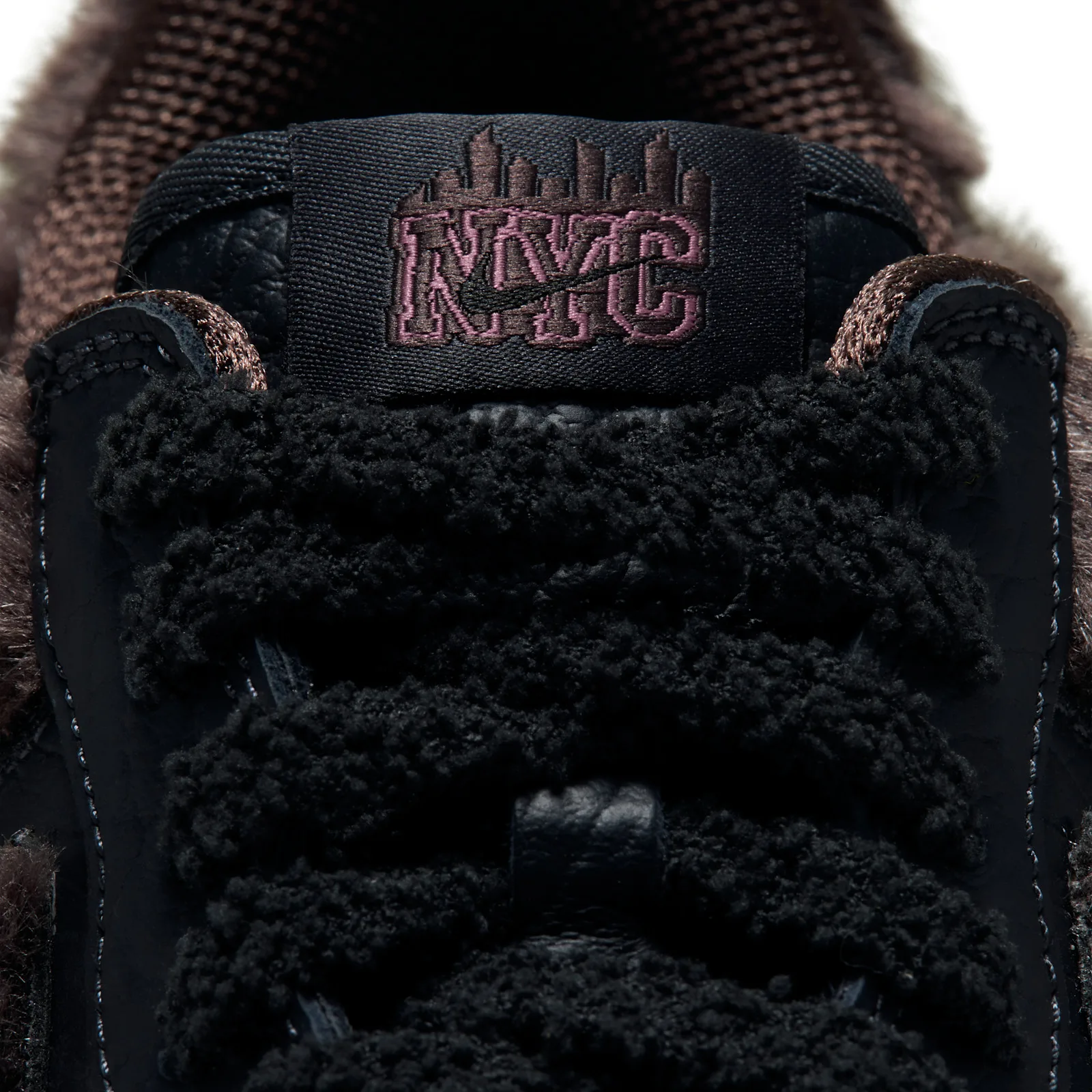 tongue close-up, black tab with skyline and pink NYC Nike script, chenille laces, NYC Rat