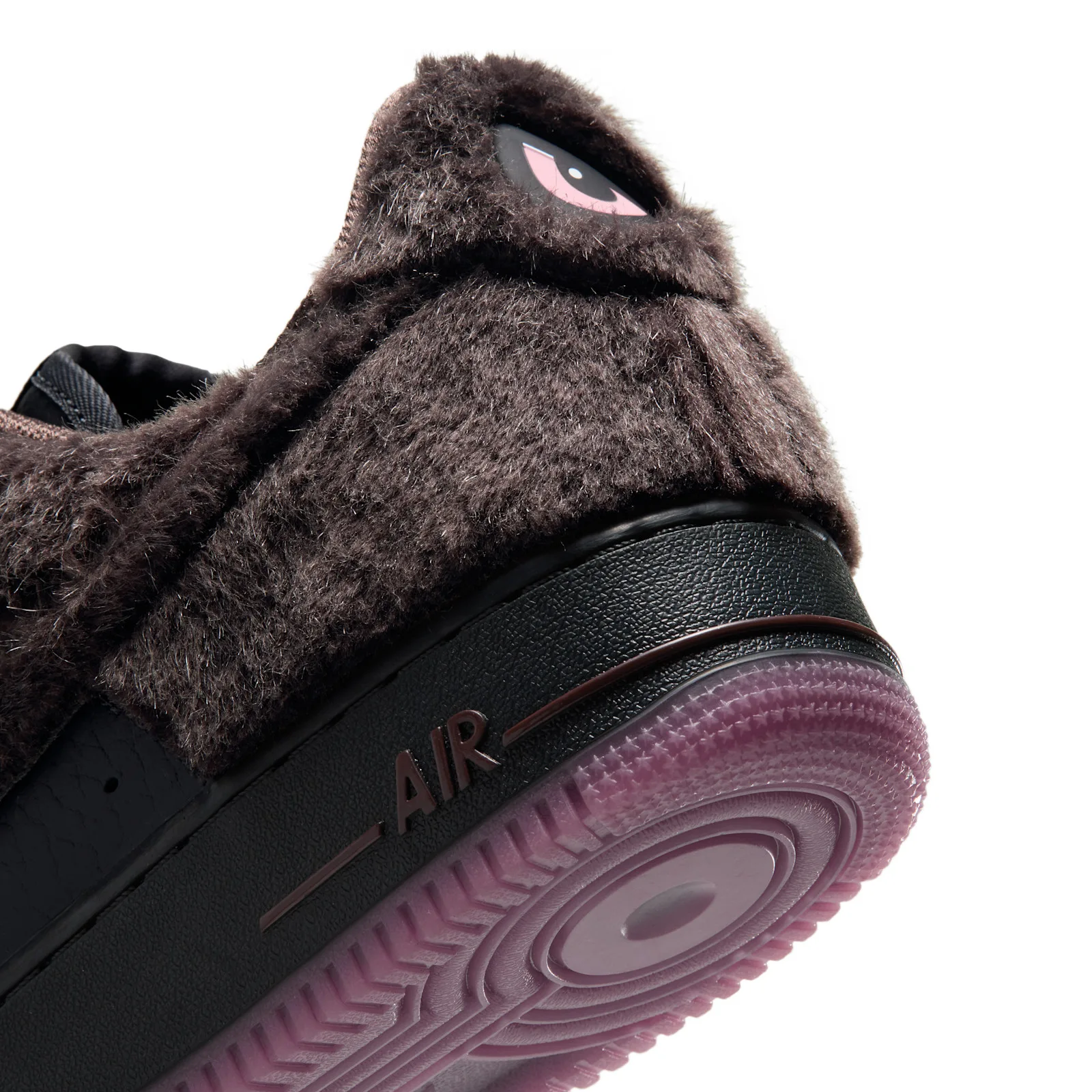 angled close-up of fur heel with pink cartoon eye graphic, purple outsole, NYC Rat