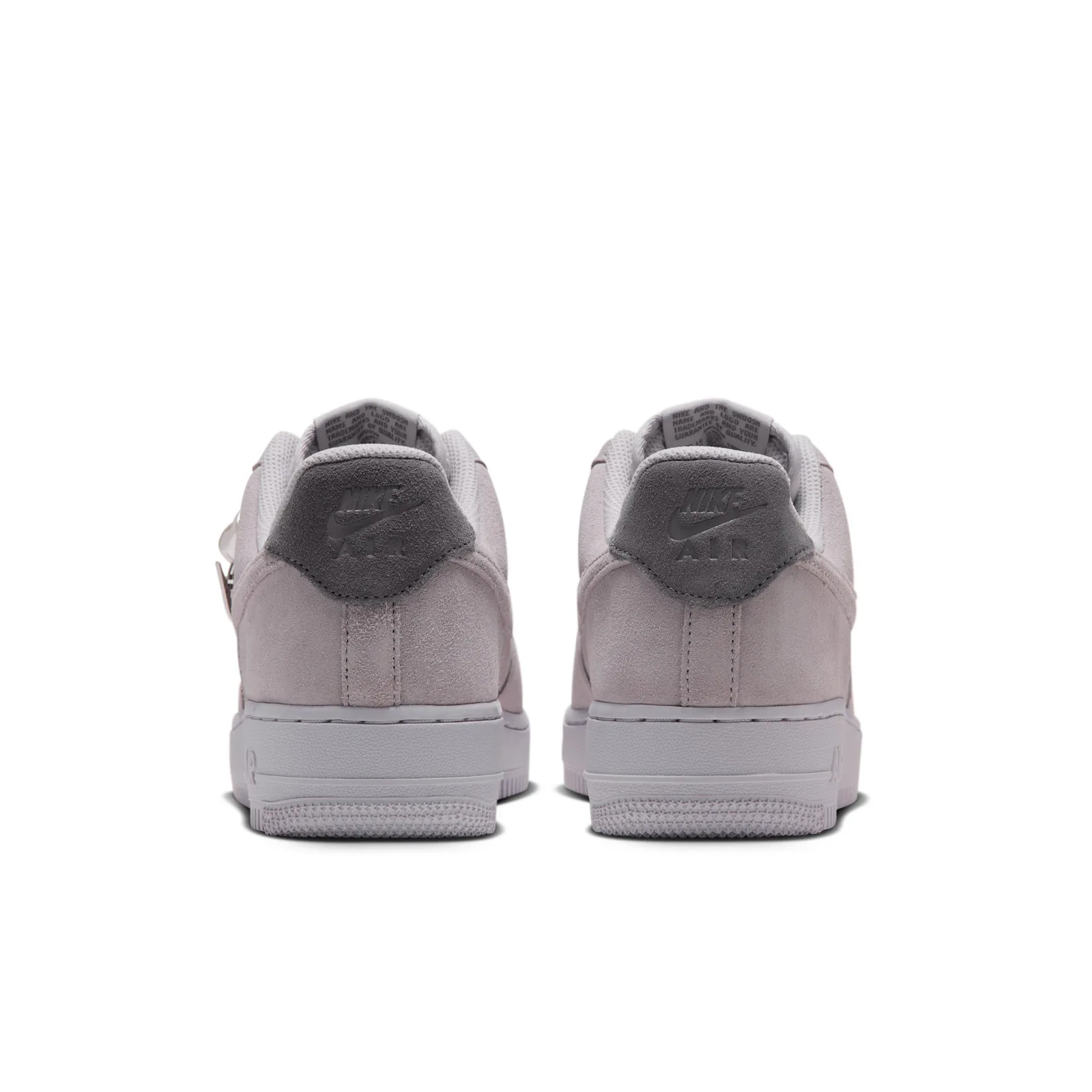 heel view of a pair, dark grey suede Nike Air tabs, mesh tongue lining, Vast Grey