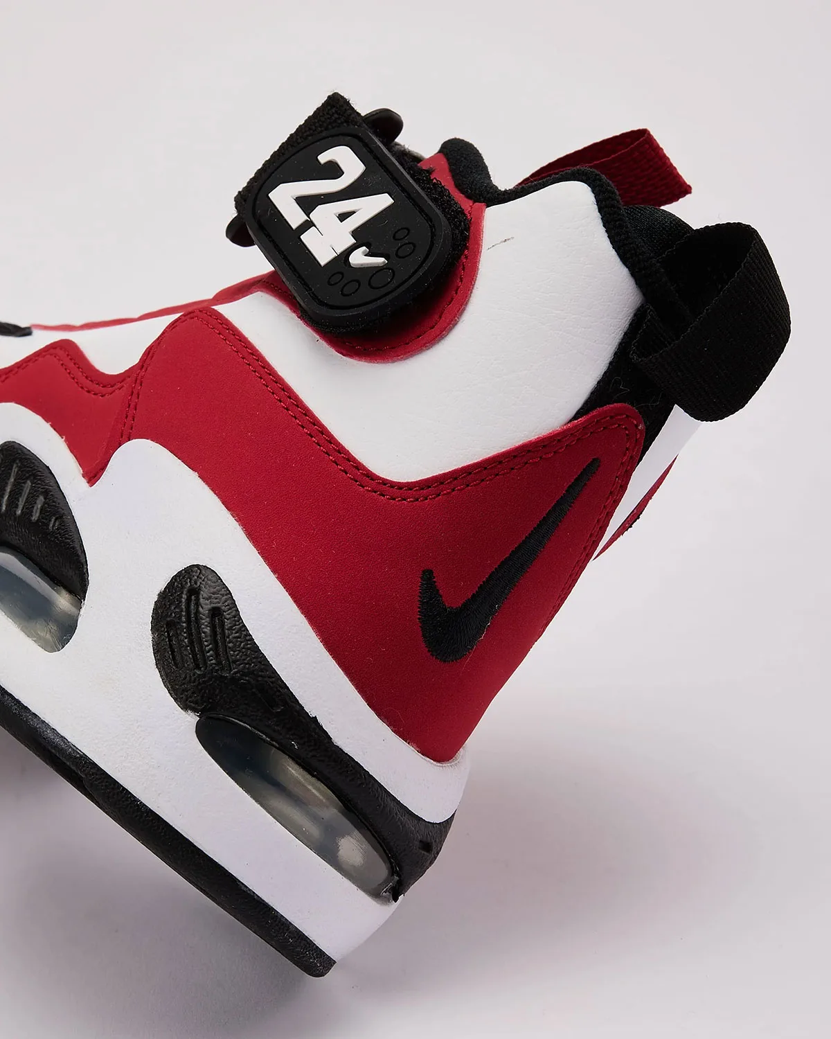close-up of heel strap with '24' logo and black embroidered swoosh, Cincinnati Reds