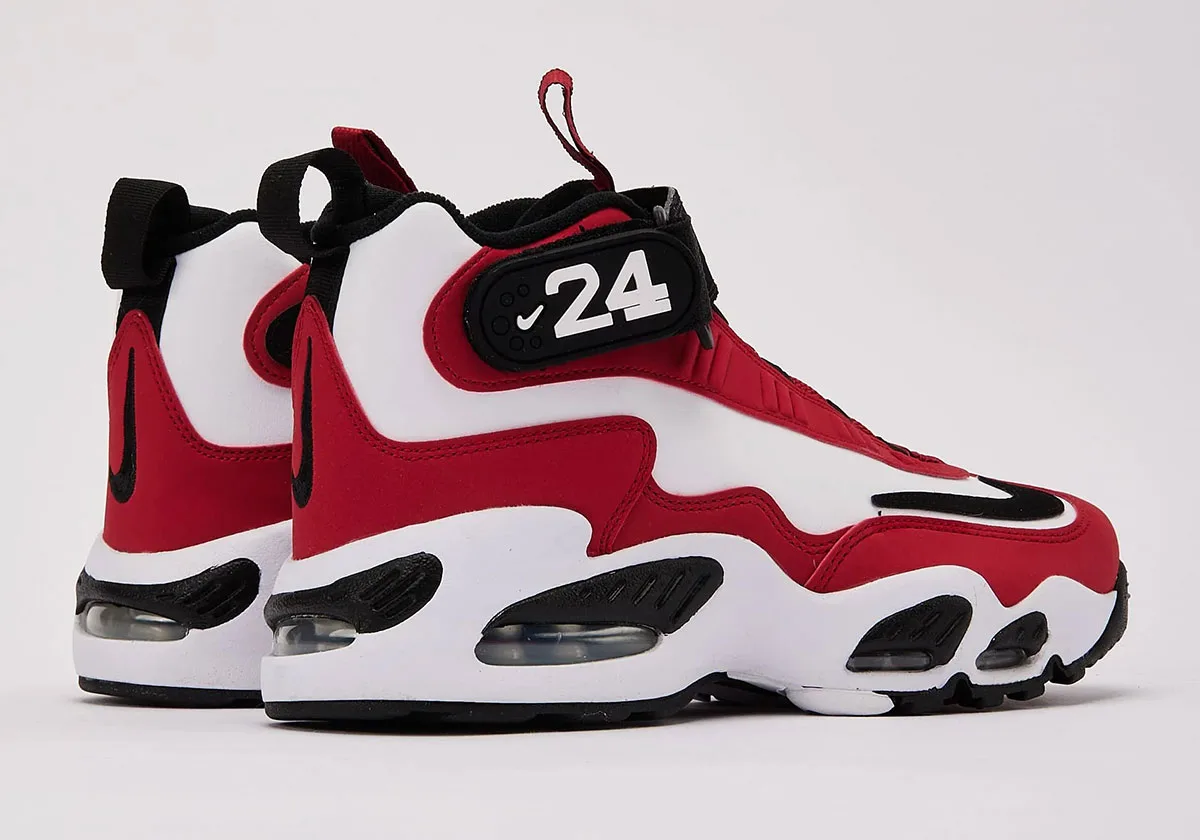 heel-side pair view, red and white uppers with black '24' ankle straps, Cincinnati Reds