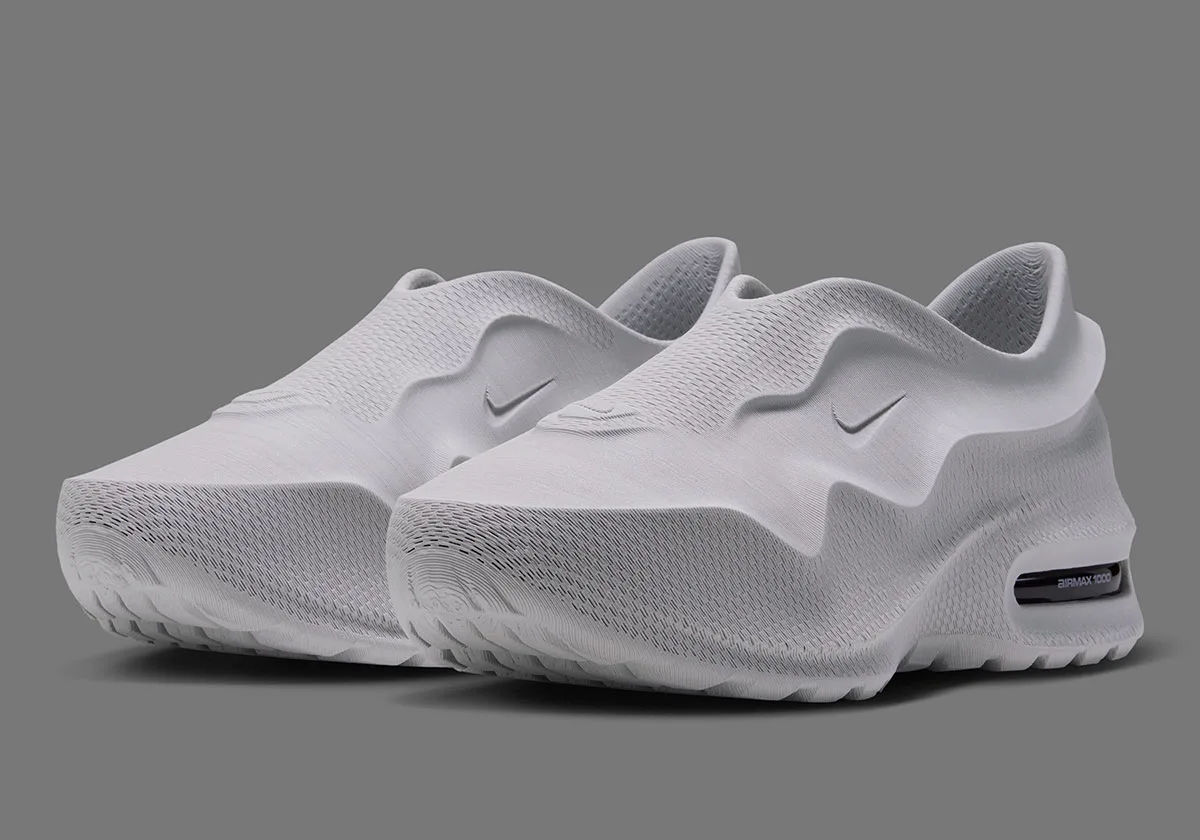 three-quarter front view of a pair, white knit uppers with tonal Swooshes and black heel window, Air Max 1000.3