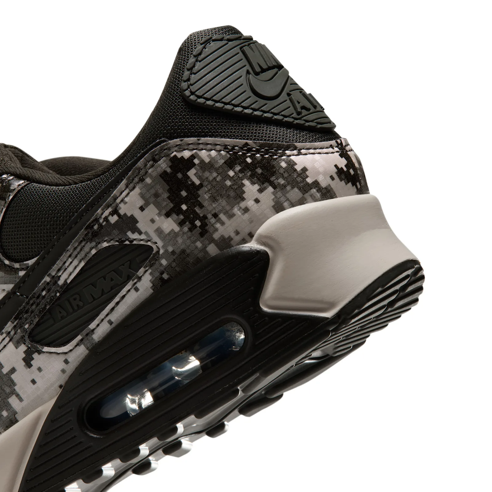 close-up heel detail with Nike Air logo and tan heel clip, Digi Camo