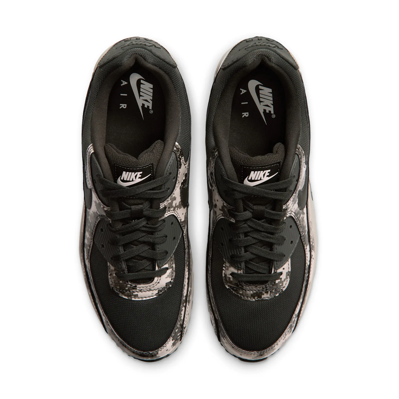 top-down pair view, black mesh tongues with Nike Air branding on insoles, Digi Camo