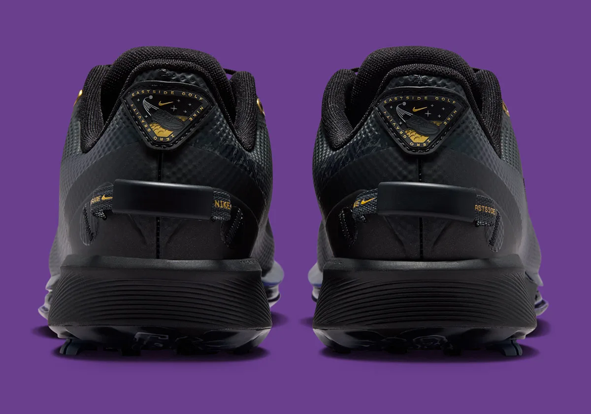 heel view of pair with triangular gold and black patch reading Eastside Golf, x Eastside Golf