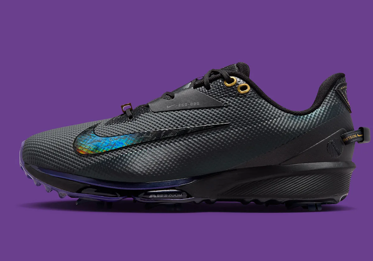 lateral view showing iridescent swoosh detail and gold lace eyelets on black upper, x Eastside Golf
