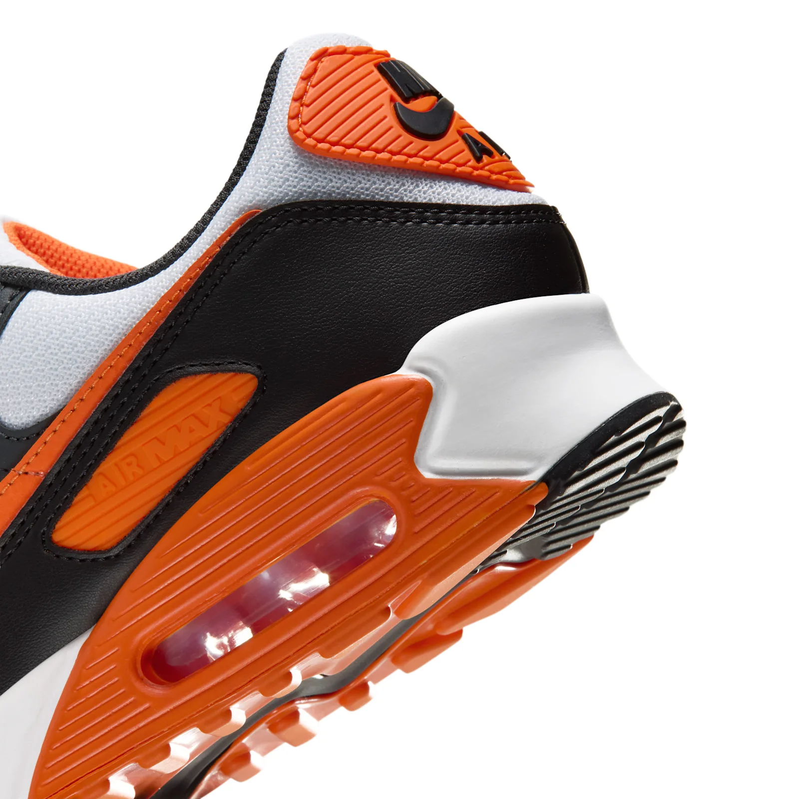 extreme close-up of heel, orange heel tab and translucent orange Air bubble, Air Max 90