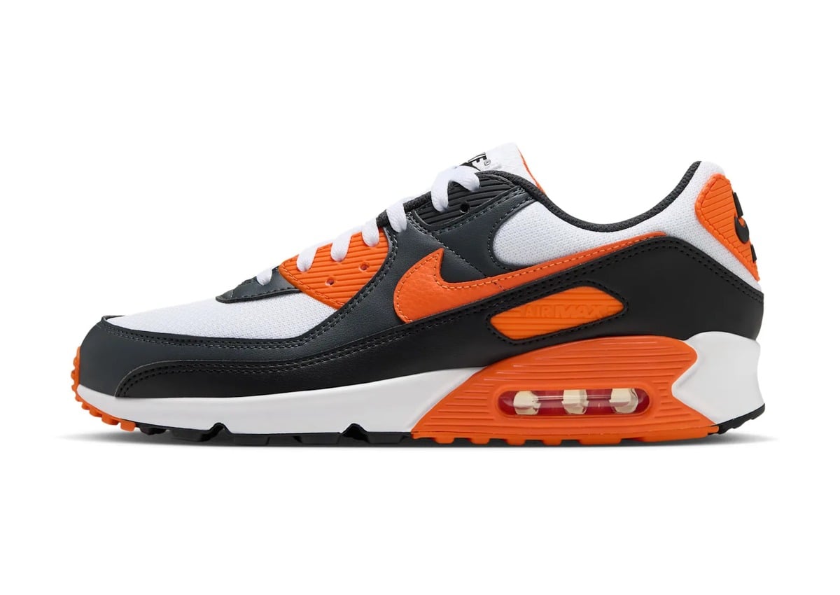 lateral view, white mesh upper with black overlays and orange swoosh, Nike Air Max 90