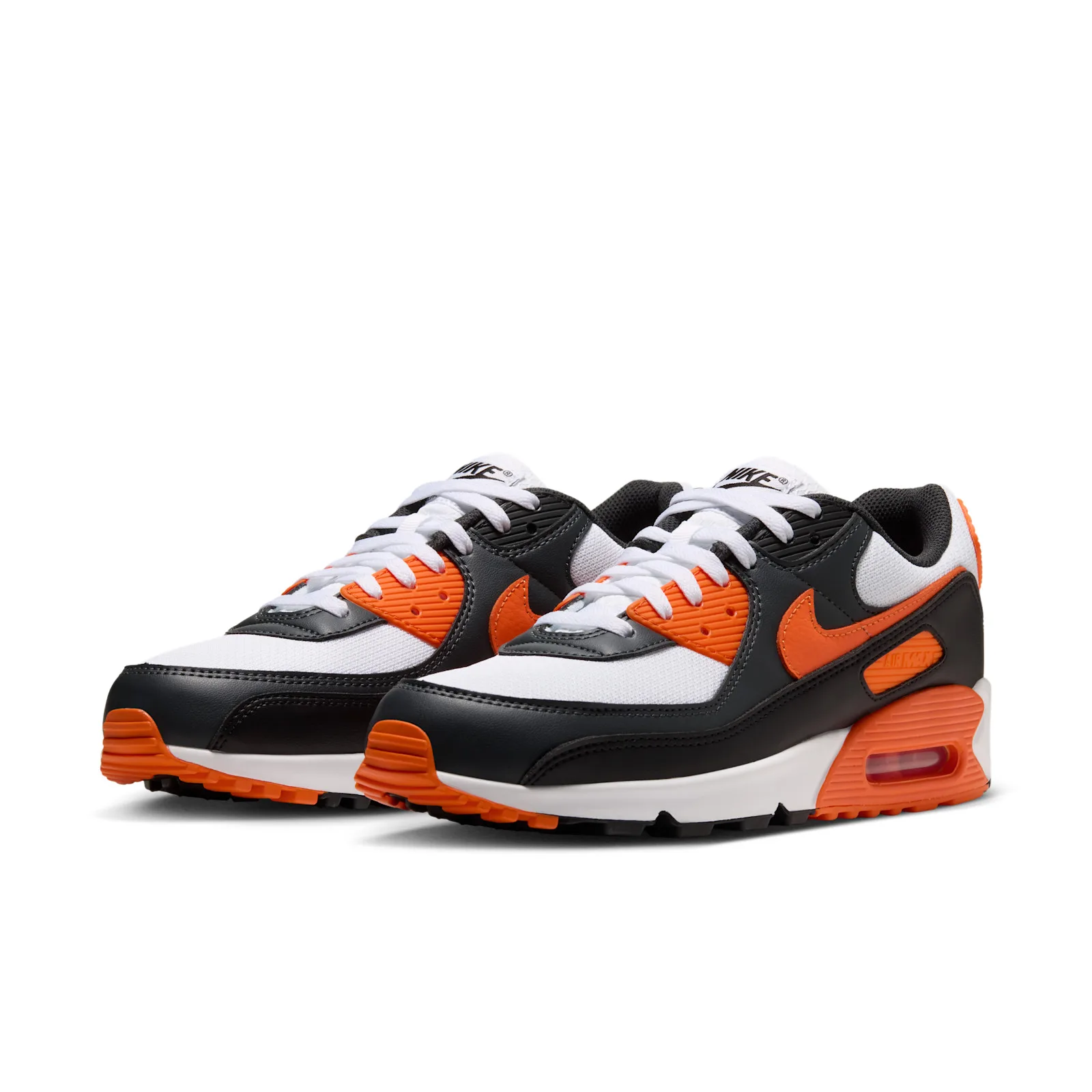 three-quarter pair view, white orange and black colourway angled toward camera, Air Max 90