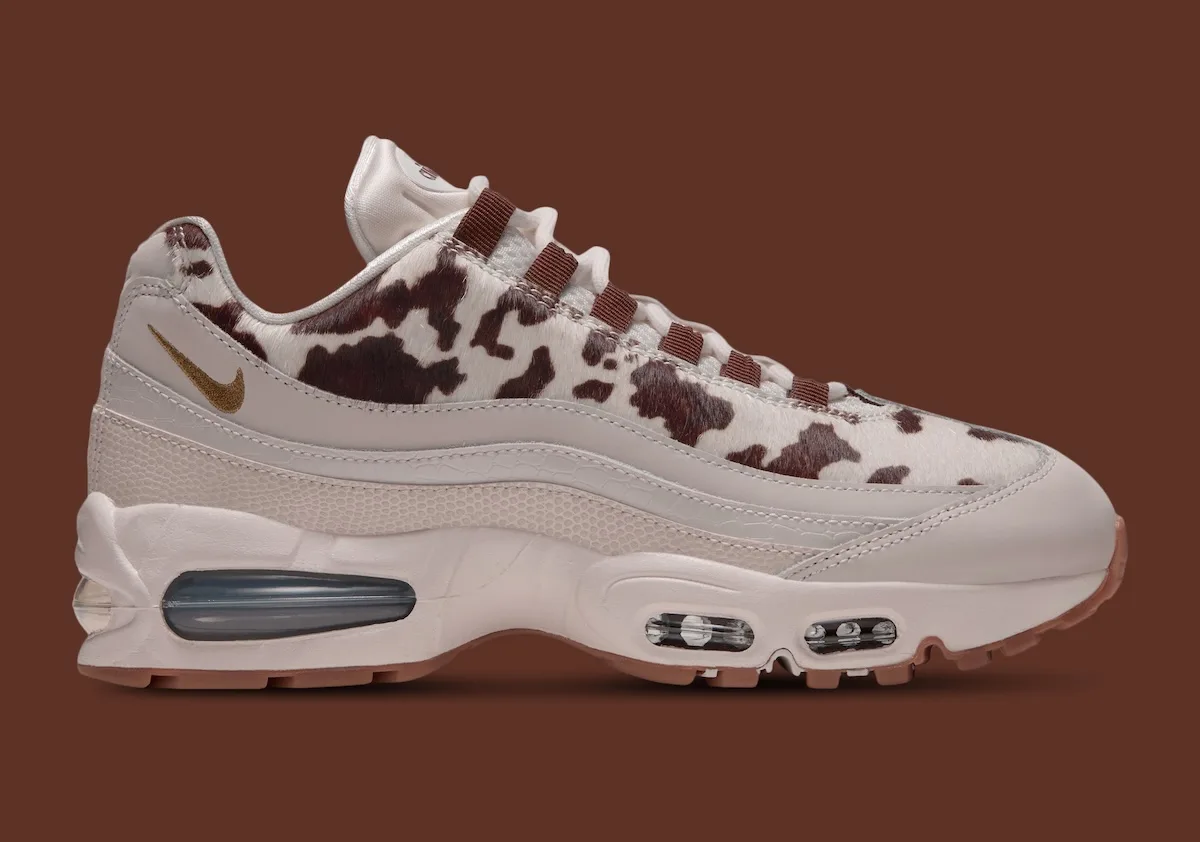 lateral view close-up, cow-print upper with tonal beige overlays and gold swoosh, Cow Print