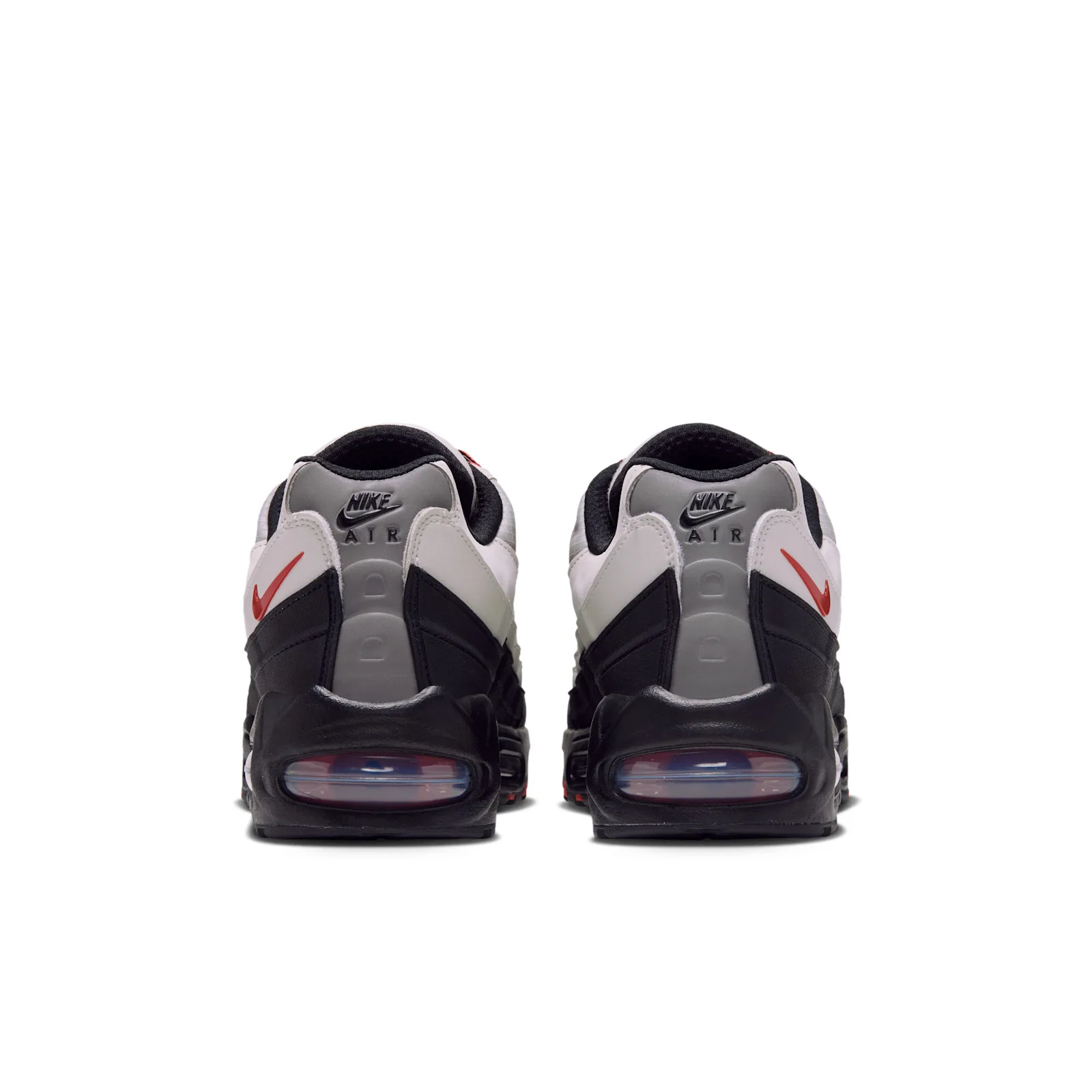 heel pair view showing red swoosh and NIKE AIR text on black tabs, Campfire Orange