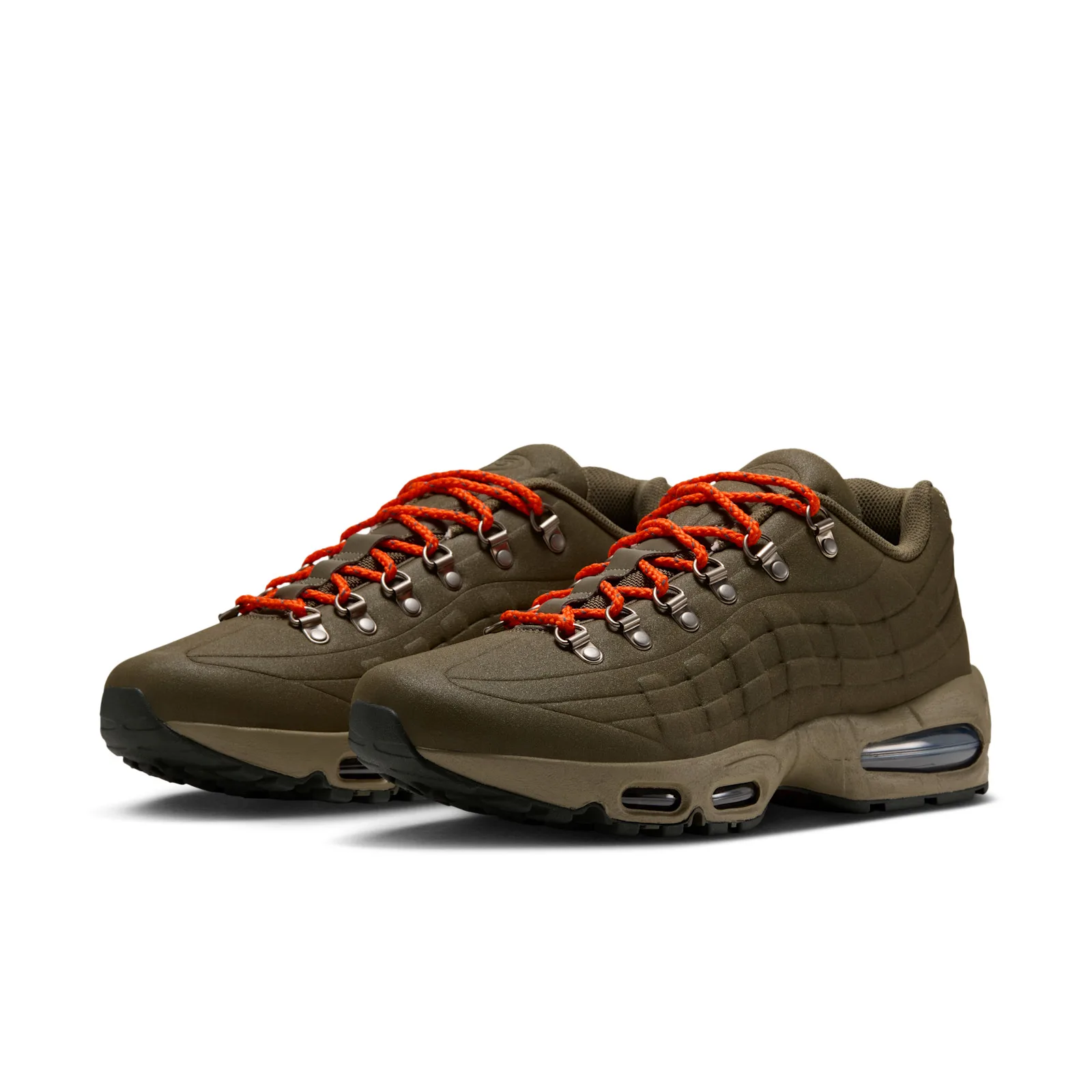 Pair in three-quarter front view, olive uppers with orange hiking laces, I 95