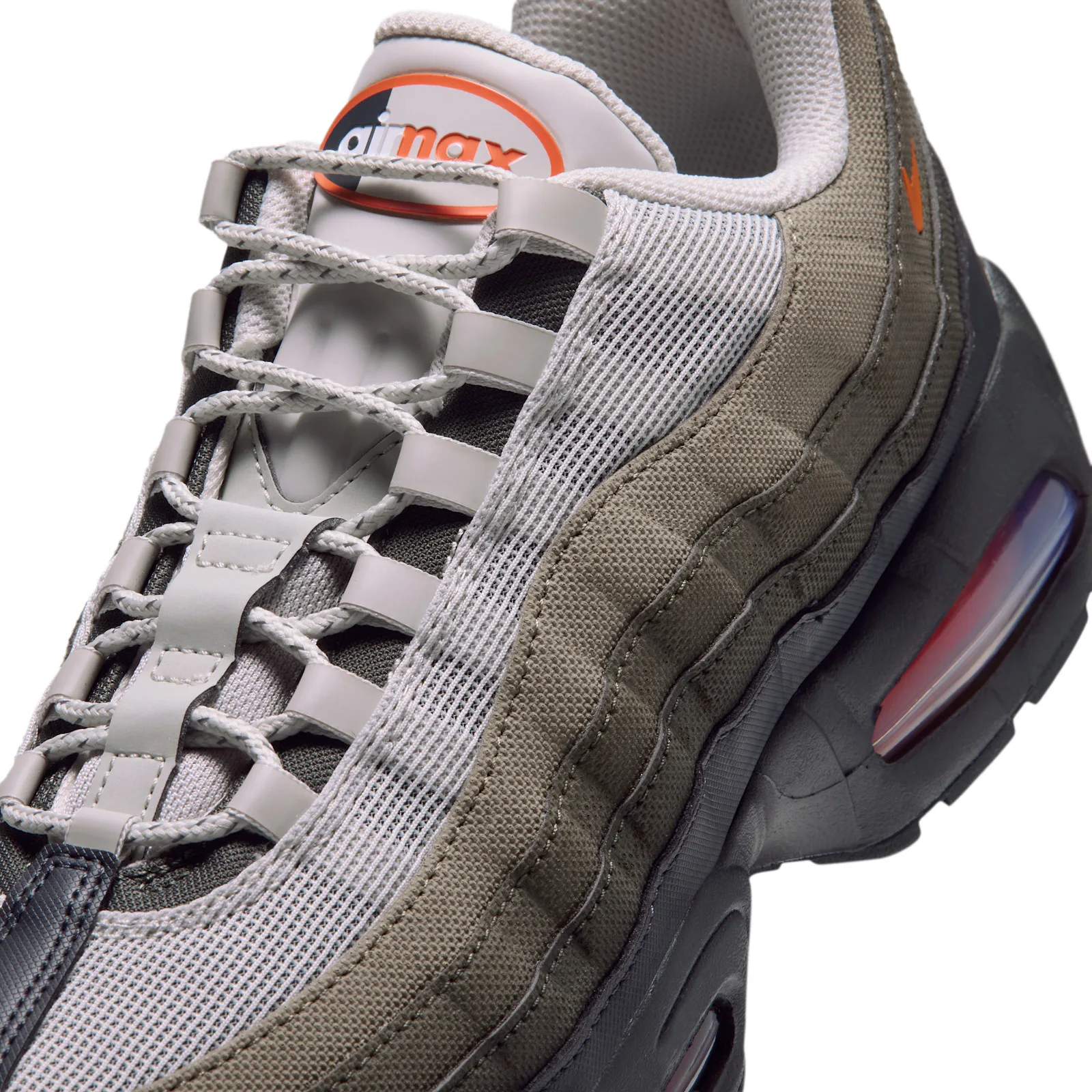 Close-up detail of the Light Bone, Grey gradient upper gets canvas fabric paneling
