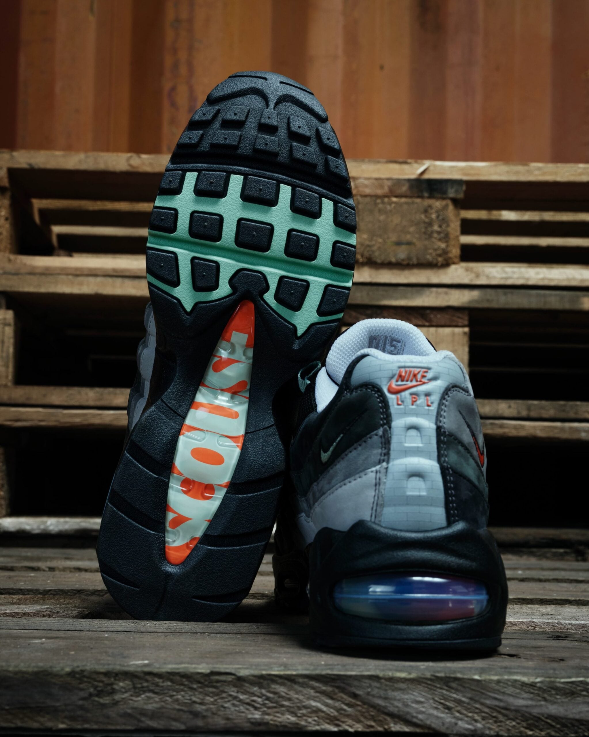 outsole and heel pair, mint waffle tread with orange 'ESCUDO' text, 'NIKE LPL' heel graphic, Liverpool
