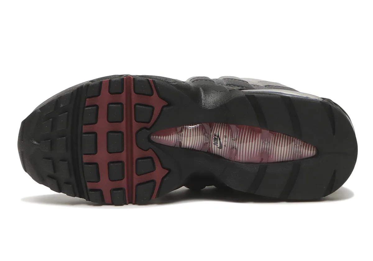 outsole view, black tread with burgundy waffle pattern and visible air unit, Pink Smoke