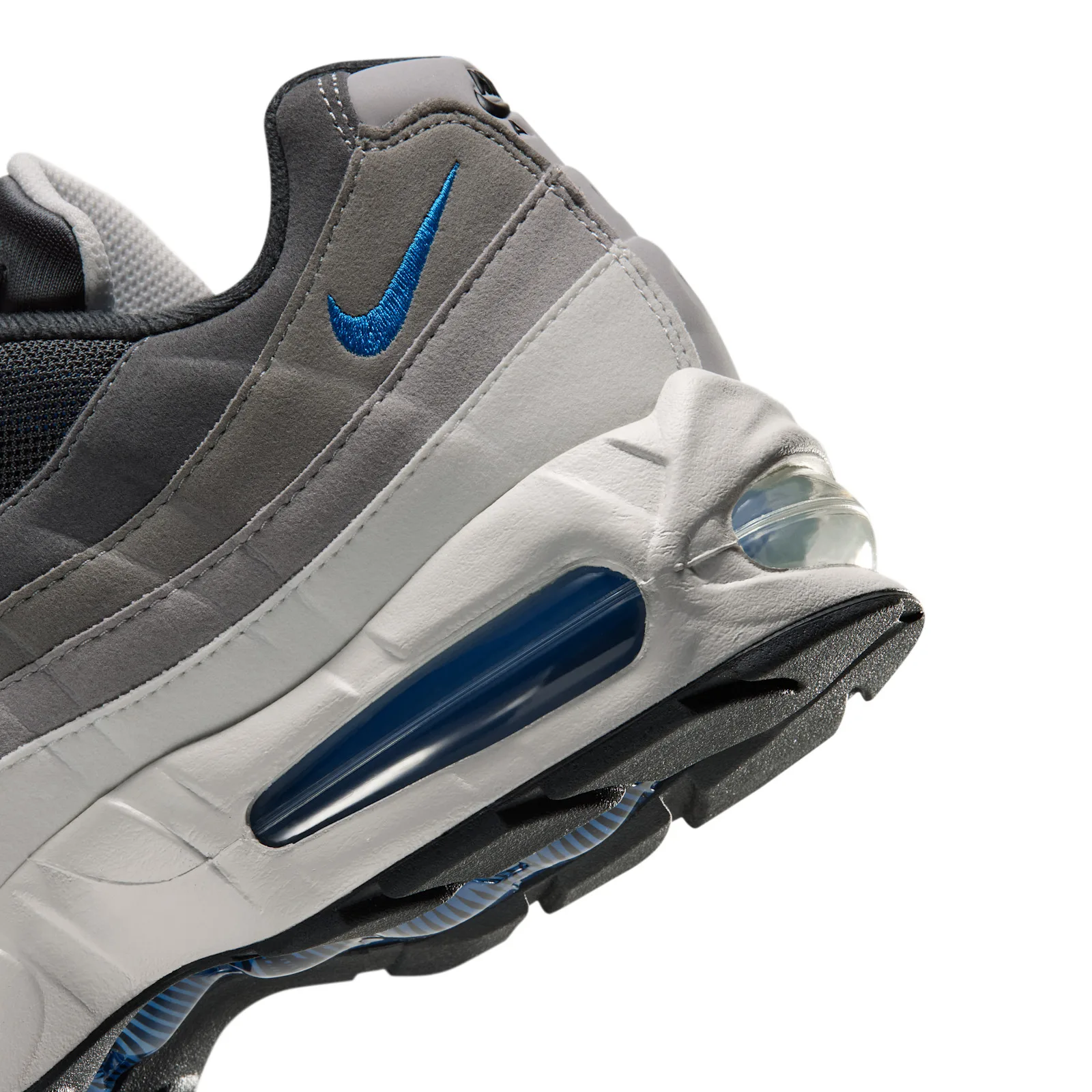 Close-up heel detail with blue embroidered swoosh and exposed blue Air bubble, Reverse Blue Spark