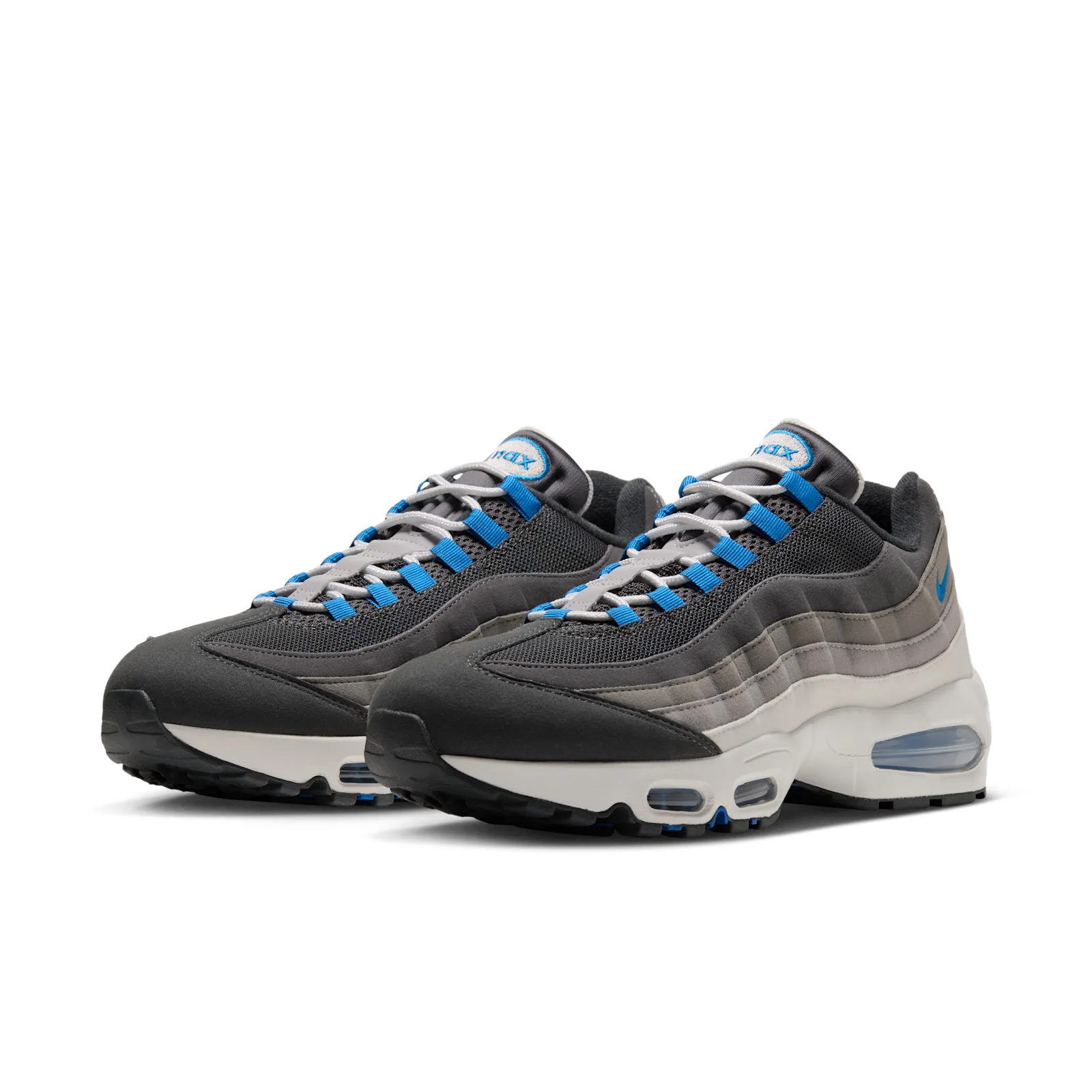 Front three-quarter pair view showing blue laces and stacked grey Nike branding, Reverse Blue Spark