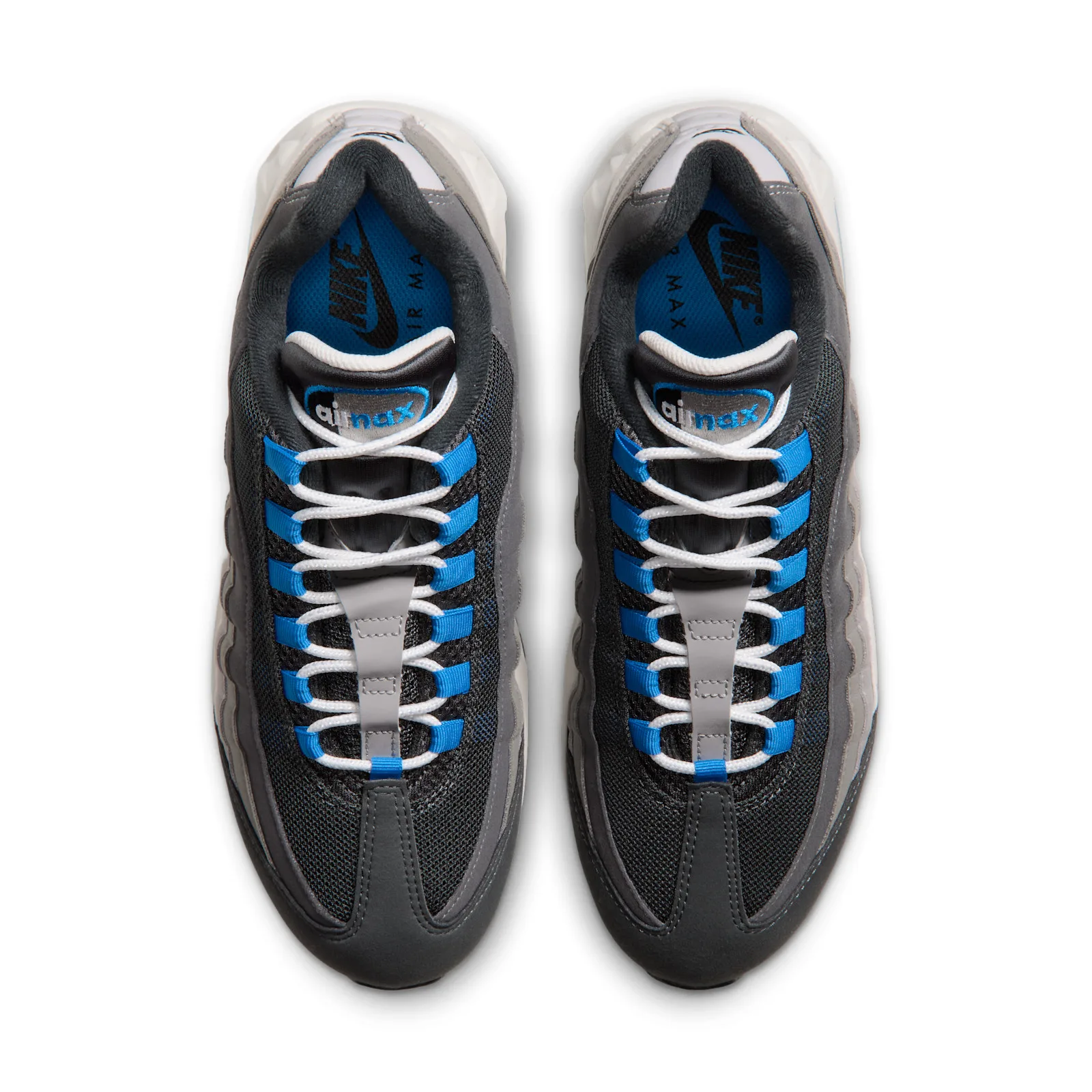 Top-down pair view of blue laces crossed over dark mesh tongues with air max tags, Reverse Blue Spark