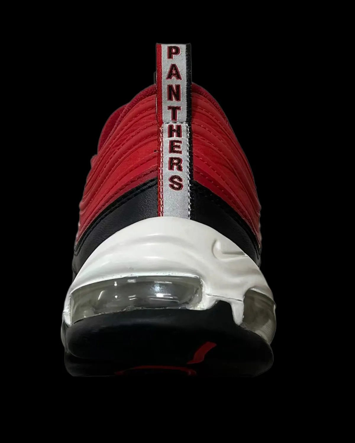 Heel view, red upper with white Panthers pull tab and visible Air unit, CAU Panthers