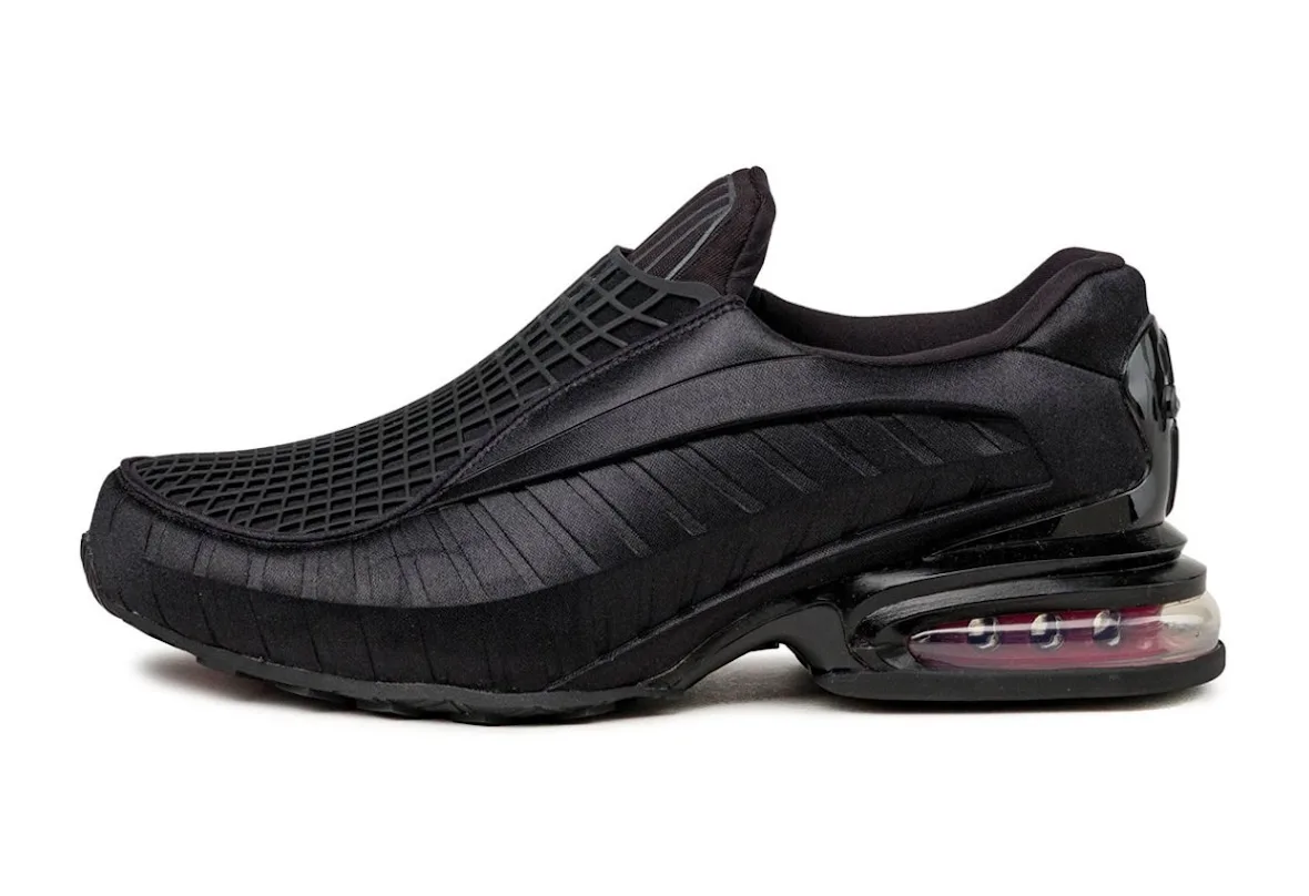 lateral side view, all-black slip-on upper with mesh toe and red Air unit at heel, Black/Sport Red