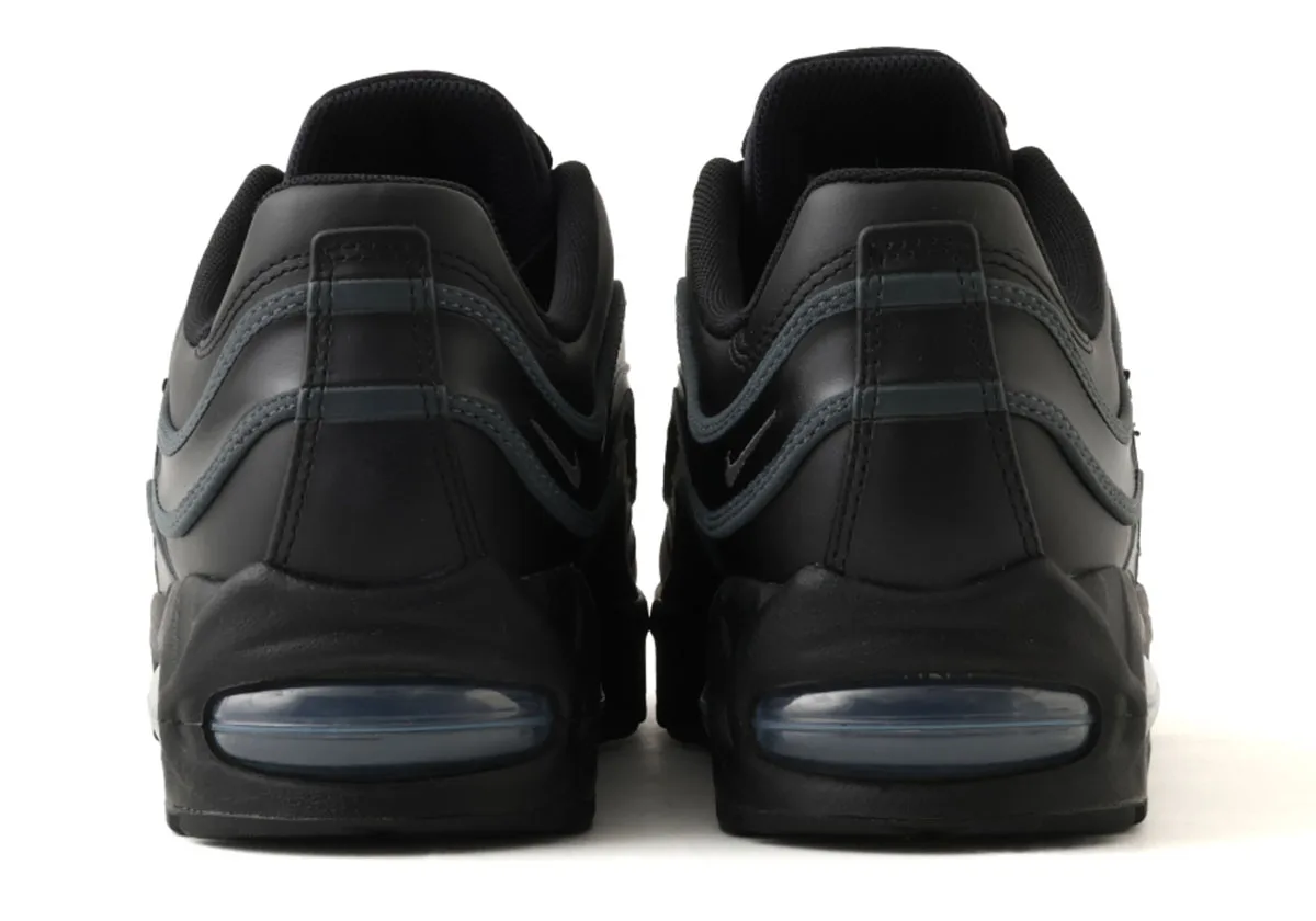 heel-on view of a pair, black leather with grey piping and smoke-tinted air units, Max Joga Bonito