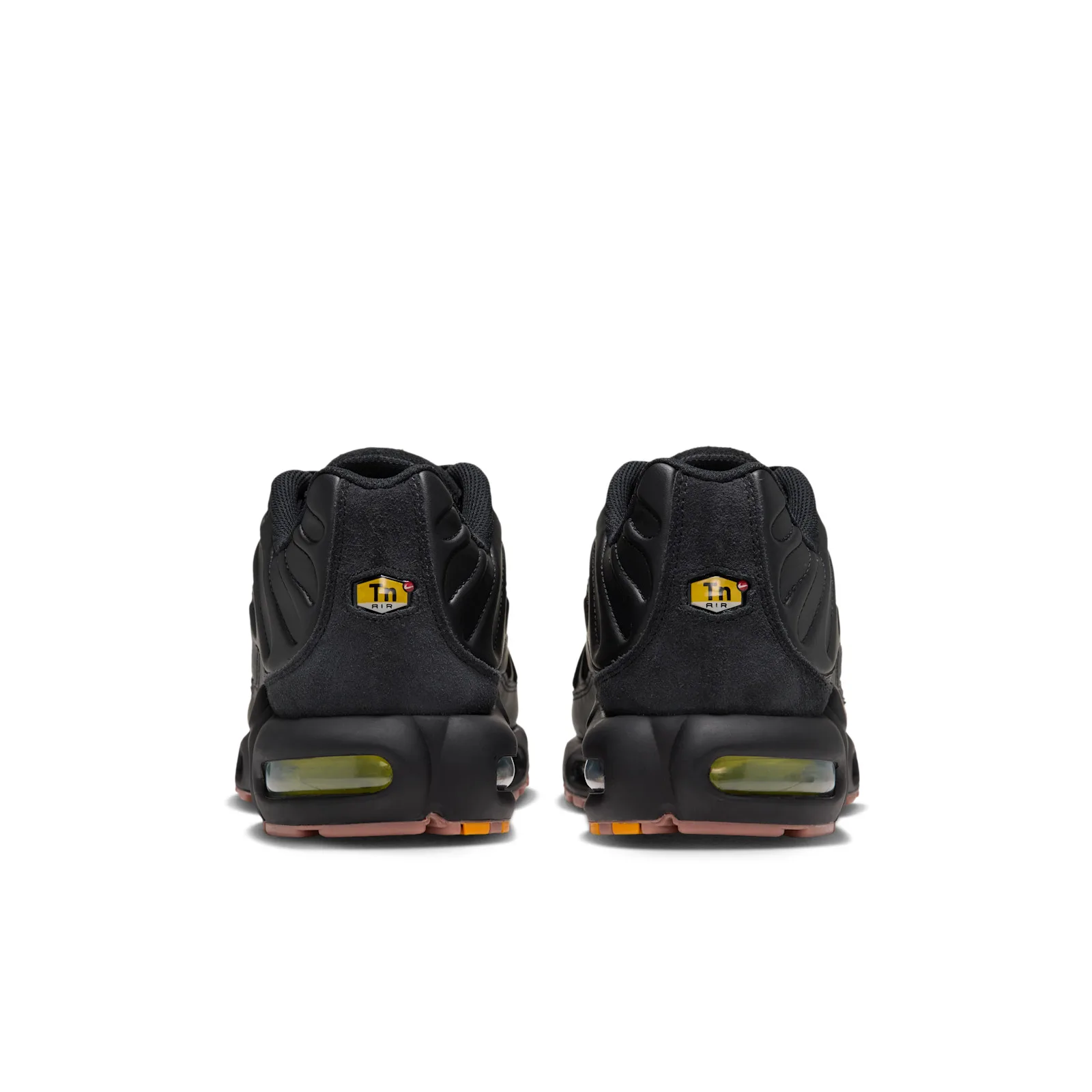 heel view of pair, black suede counters, yellow 'Tn Air' heel tags, olive air units, pink outsole, Premier
