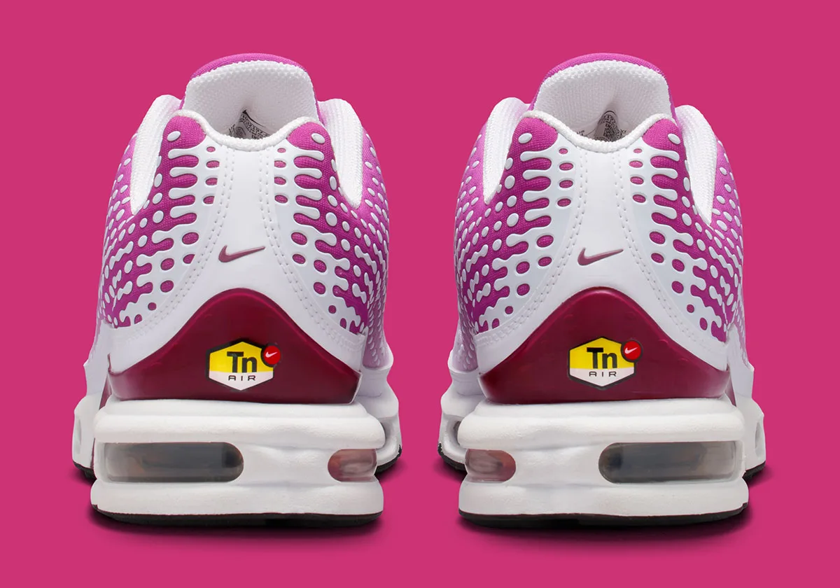 heel view of pair, magenta dotted texture with yellow Tn Air tab, Raspberry Red