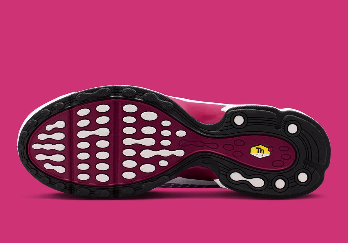 outsole view, black tread with dark red waffle pattern and Tn Air tag, Raspberry Red