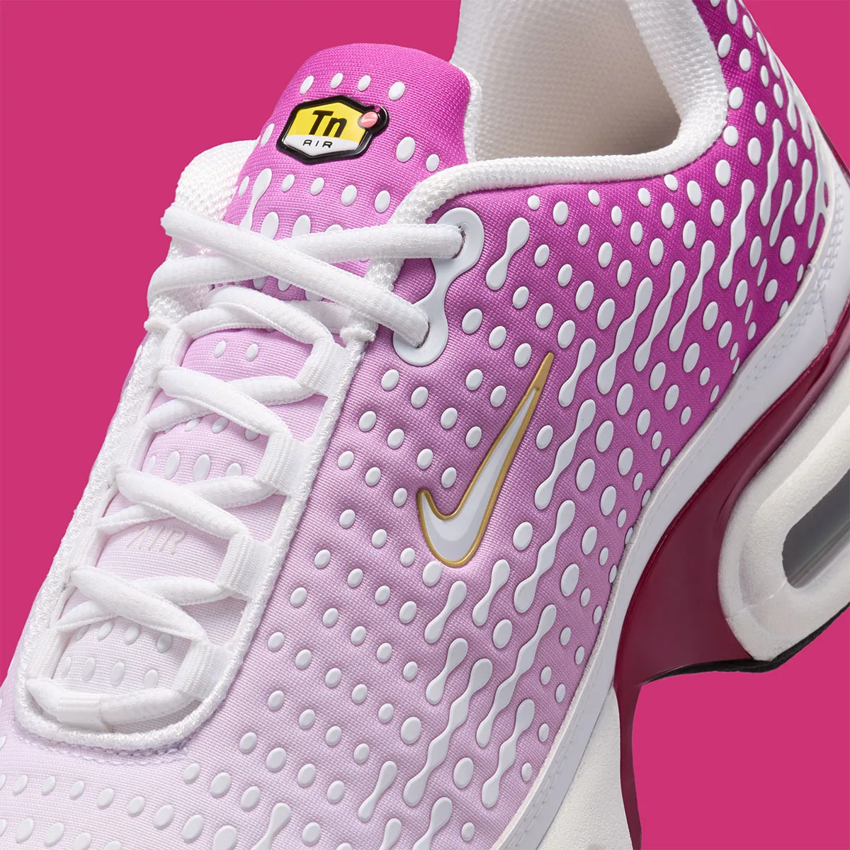 close-up toe detail, dotted magenta gradient with gold swoosh and laces, Raspberry Red