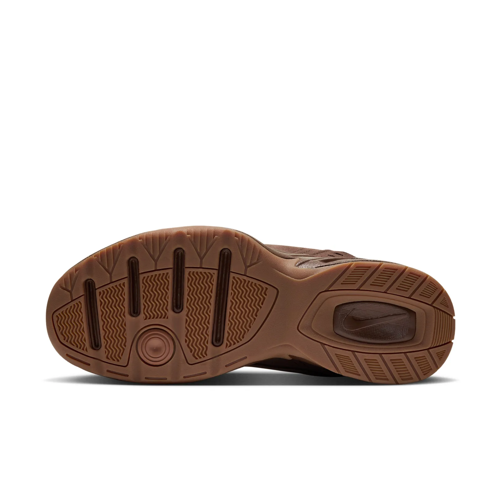 outsole close-up, brown suede sole with Nike logo and gum traction pattern, Suede