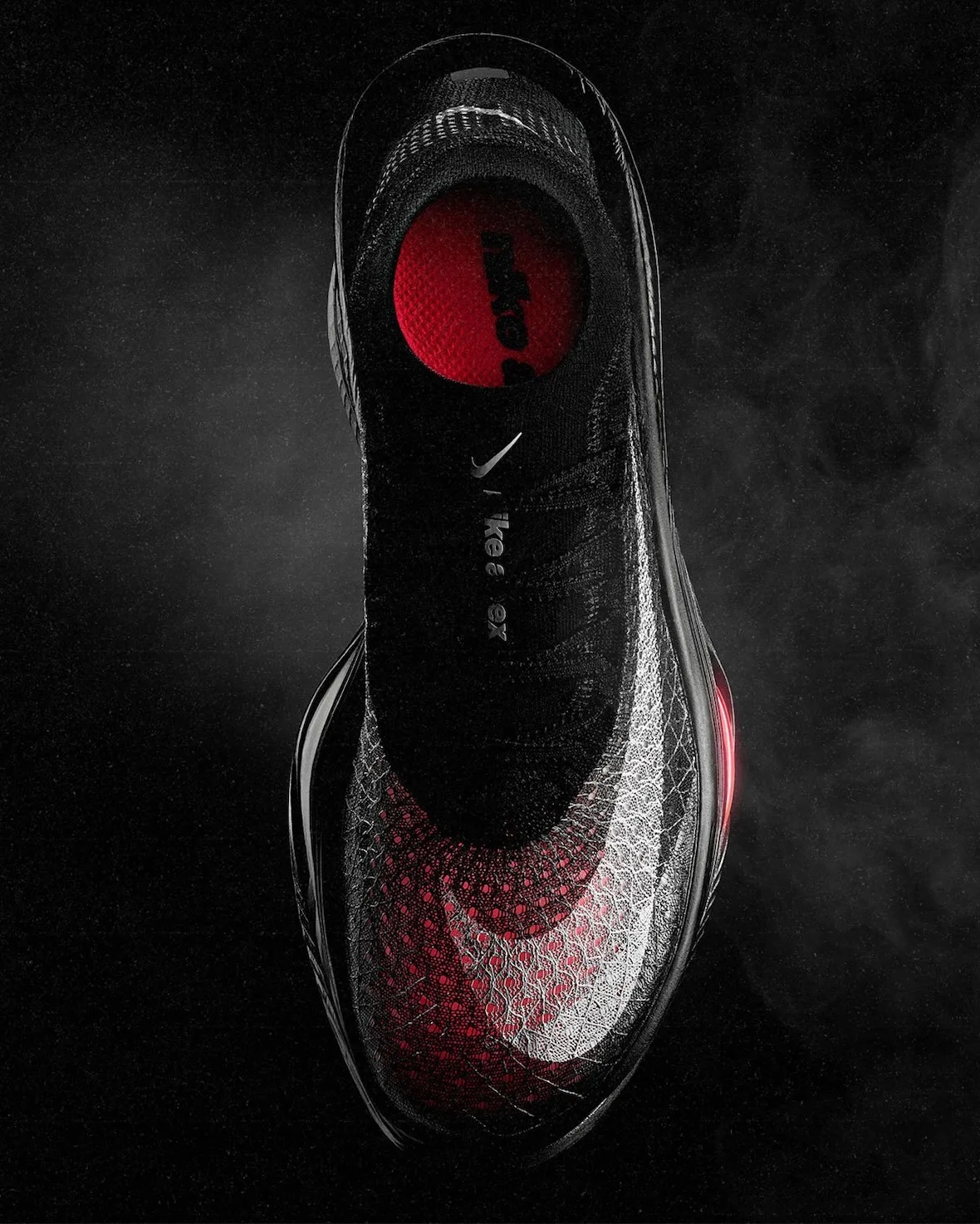 top-down view, black upper with red heel insole and nike swoosh detail, Nike Apex
