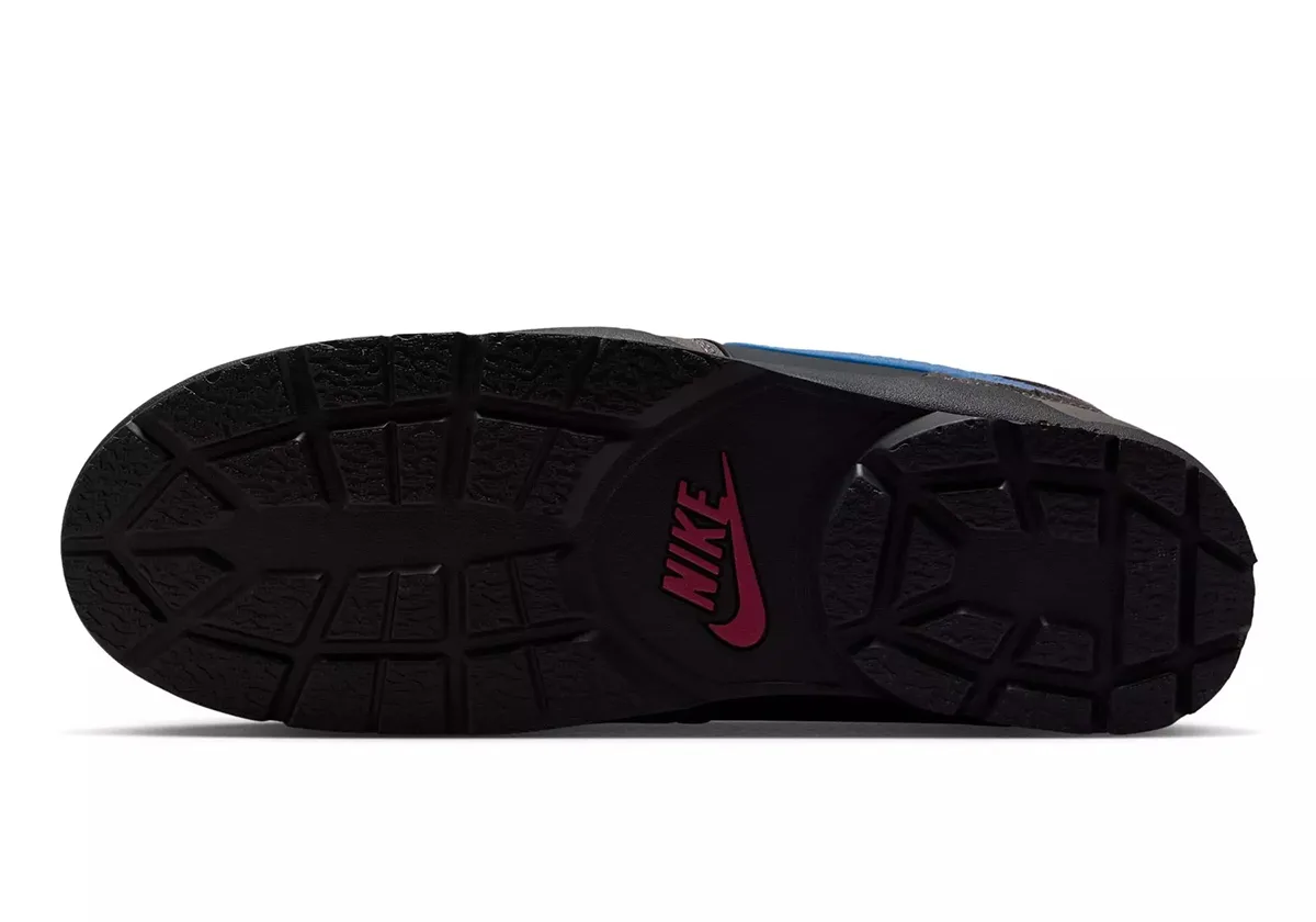 outsole view, black lugged tread with dark red Nike swoosh at heel, Cave Stone/Mystic Hibiscus