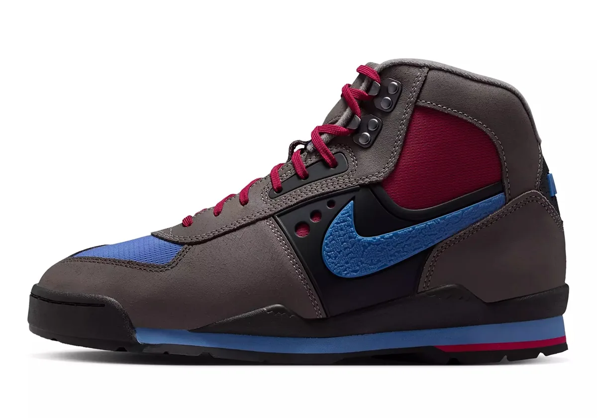 lateral view showing blue textured Nike swoosh on black heel panel, Cave Stone/Mystic Hibiscus