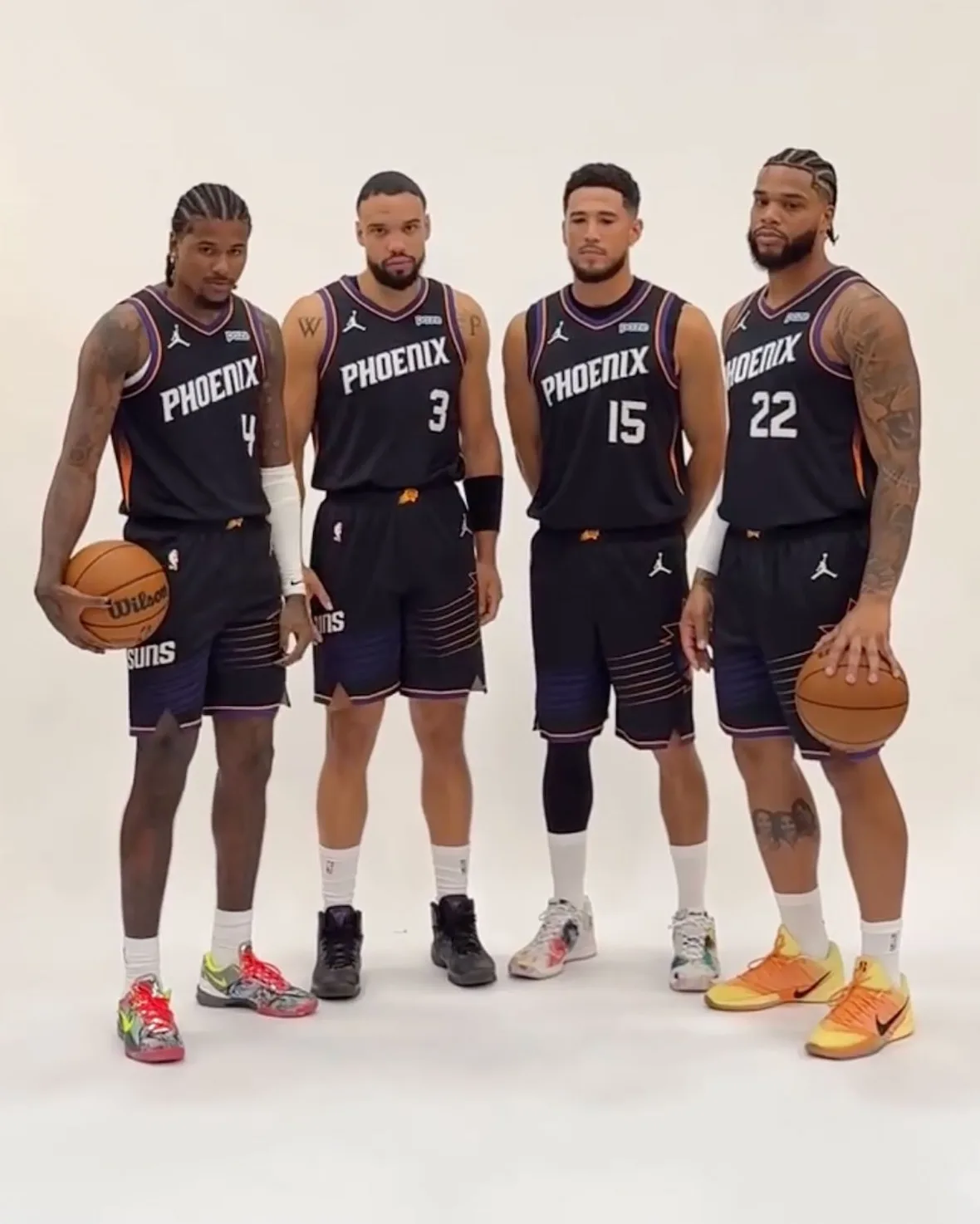 on-foot group shot, four players standing, white scribble-print pair worn by center player, 2 x Futura