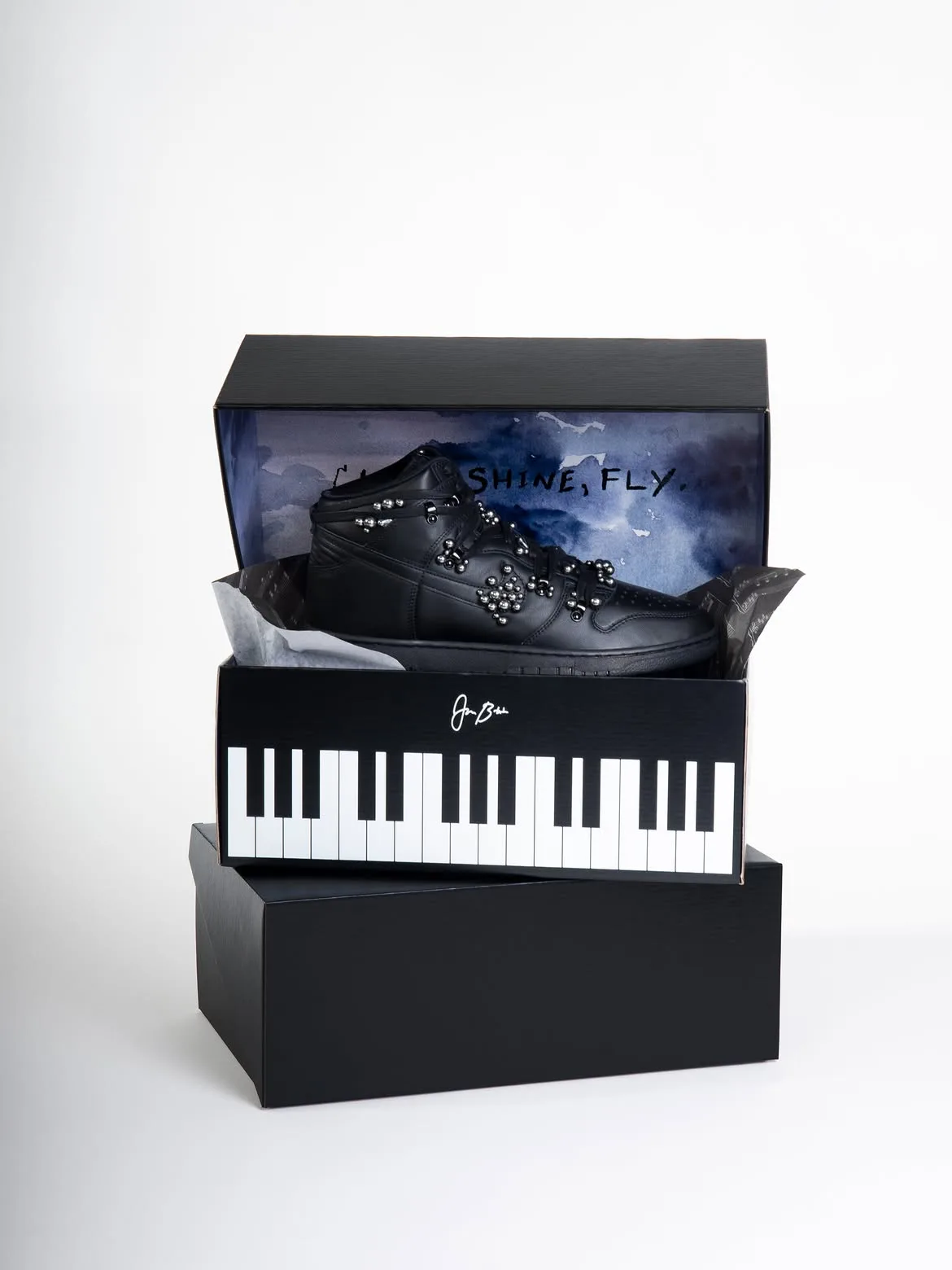 pair displayed in tiered packaging, piano-key box and watercolor sky lid, Maestro 1