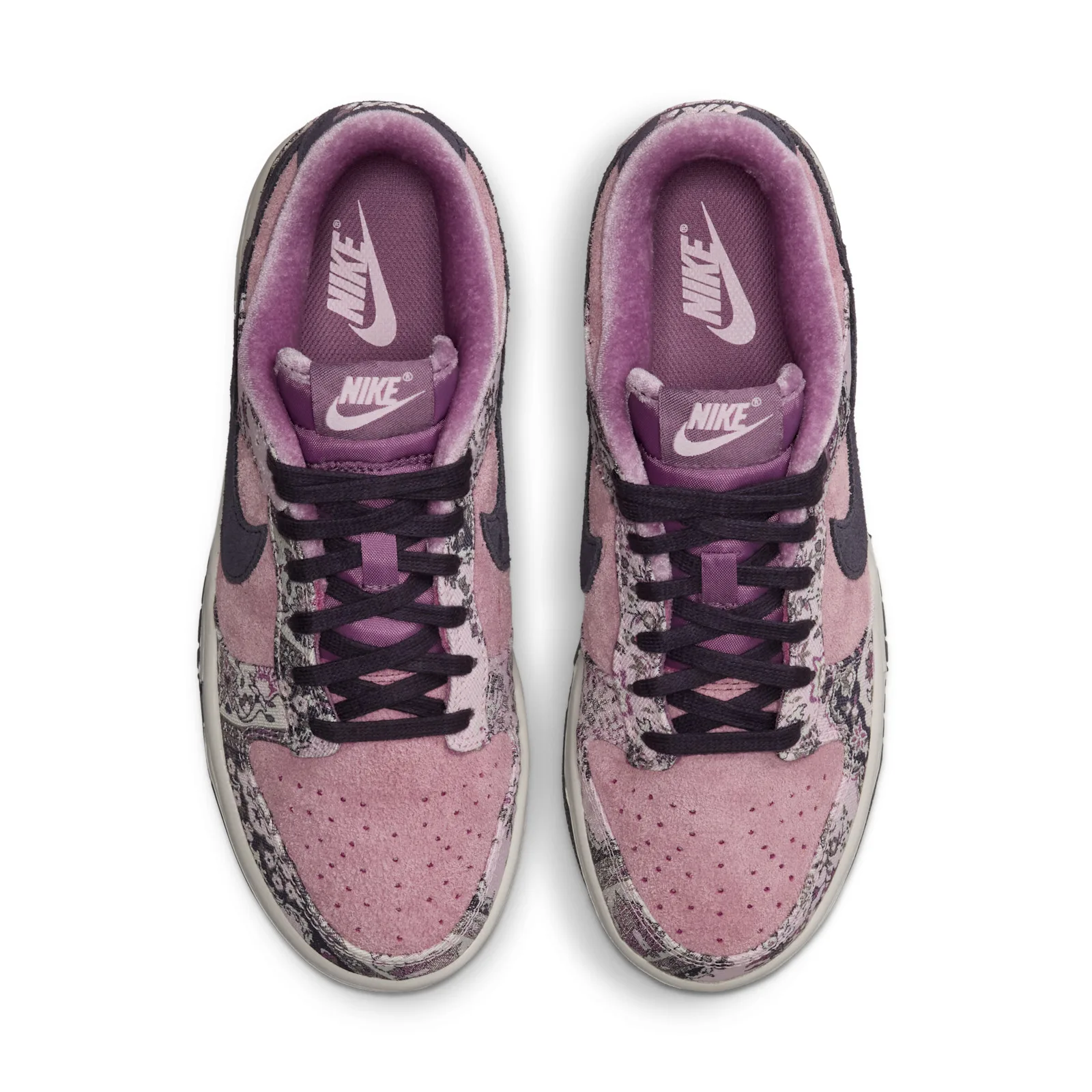 Top-down pair view, pink insoles with Nike swoosh and dark laces, Botanical Rug