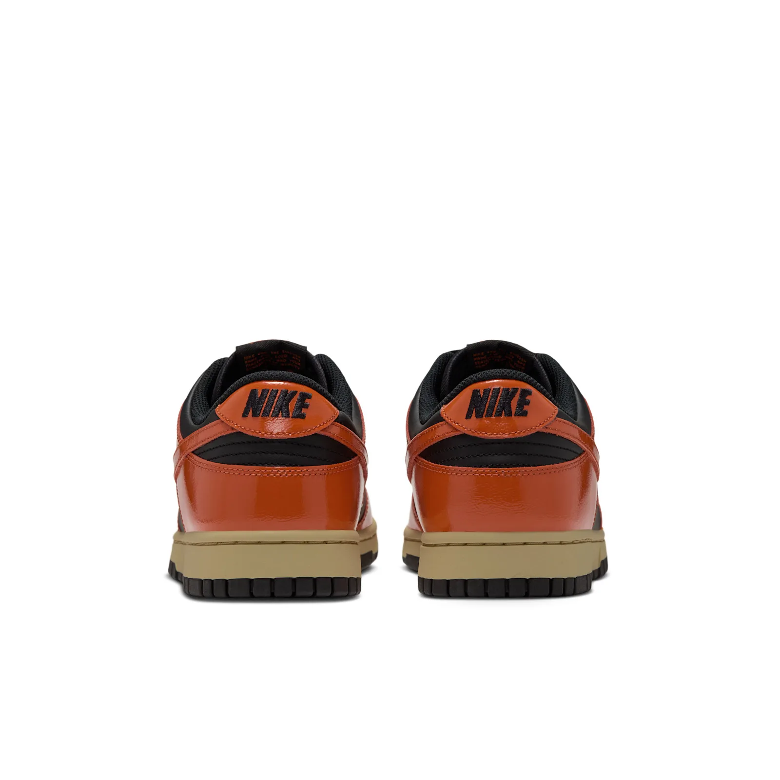 Heel view of pair on white background, orange heel tabs with black NIKE text, Campfire Orange