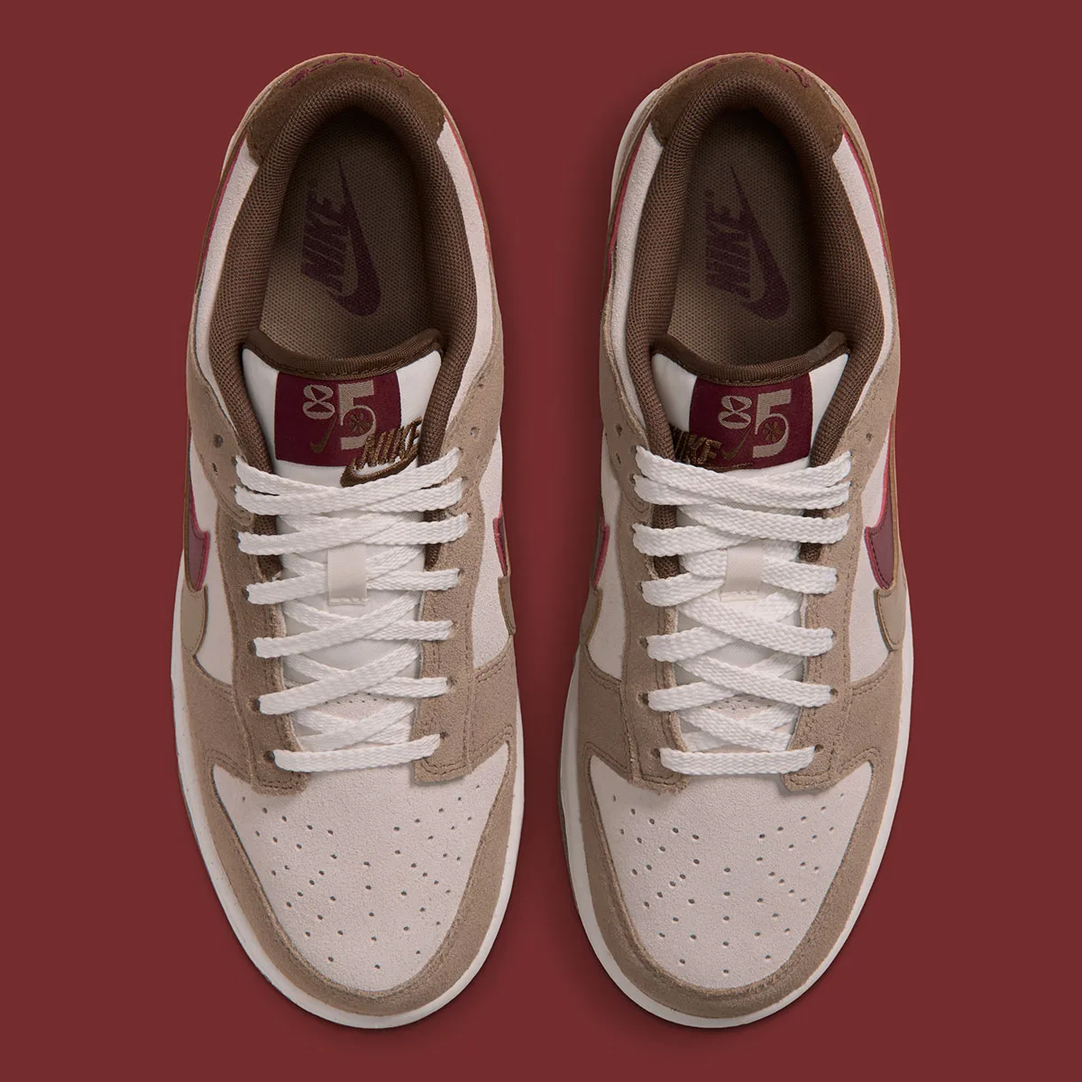 top-down view of pair, cream and tan suede with maroon '85' tongue tabs, Double Swoosh