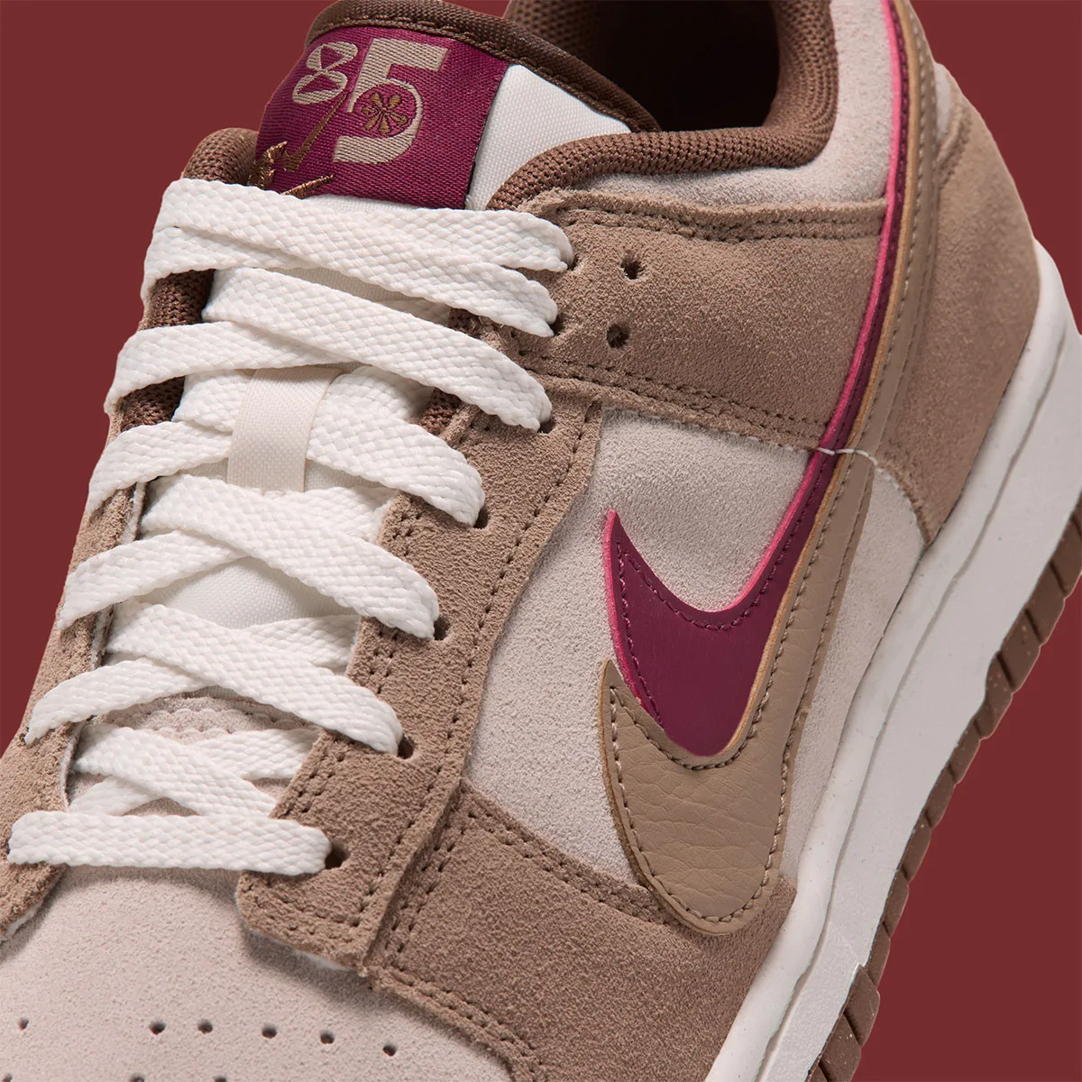 close-up of toe and eyelets, maroon swoosh and '85' tongue tab with white laces, Double Swoosh