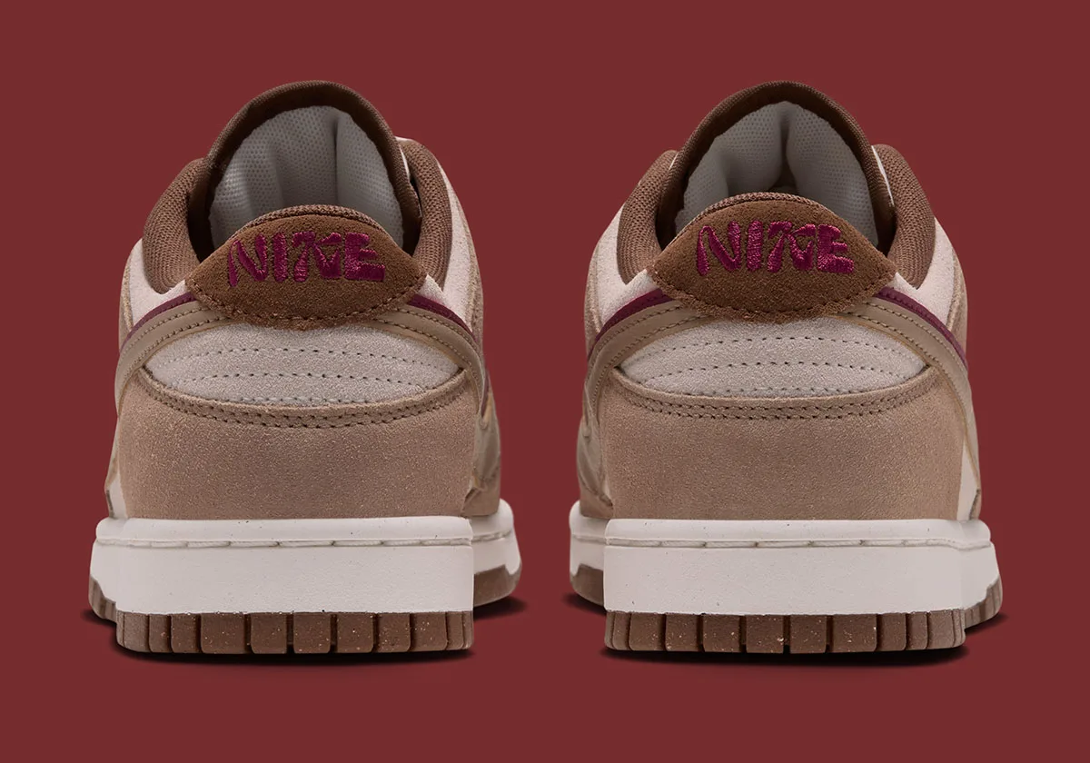 heel view of pair, tan suede with pink Nike script on brown pull tabs, Nike Dunk Low "Double Swoosh"