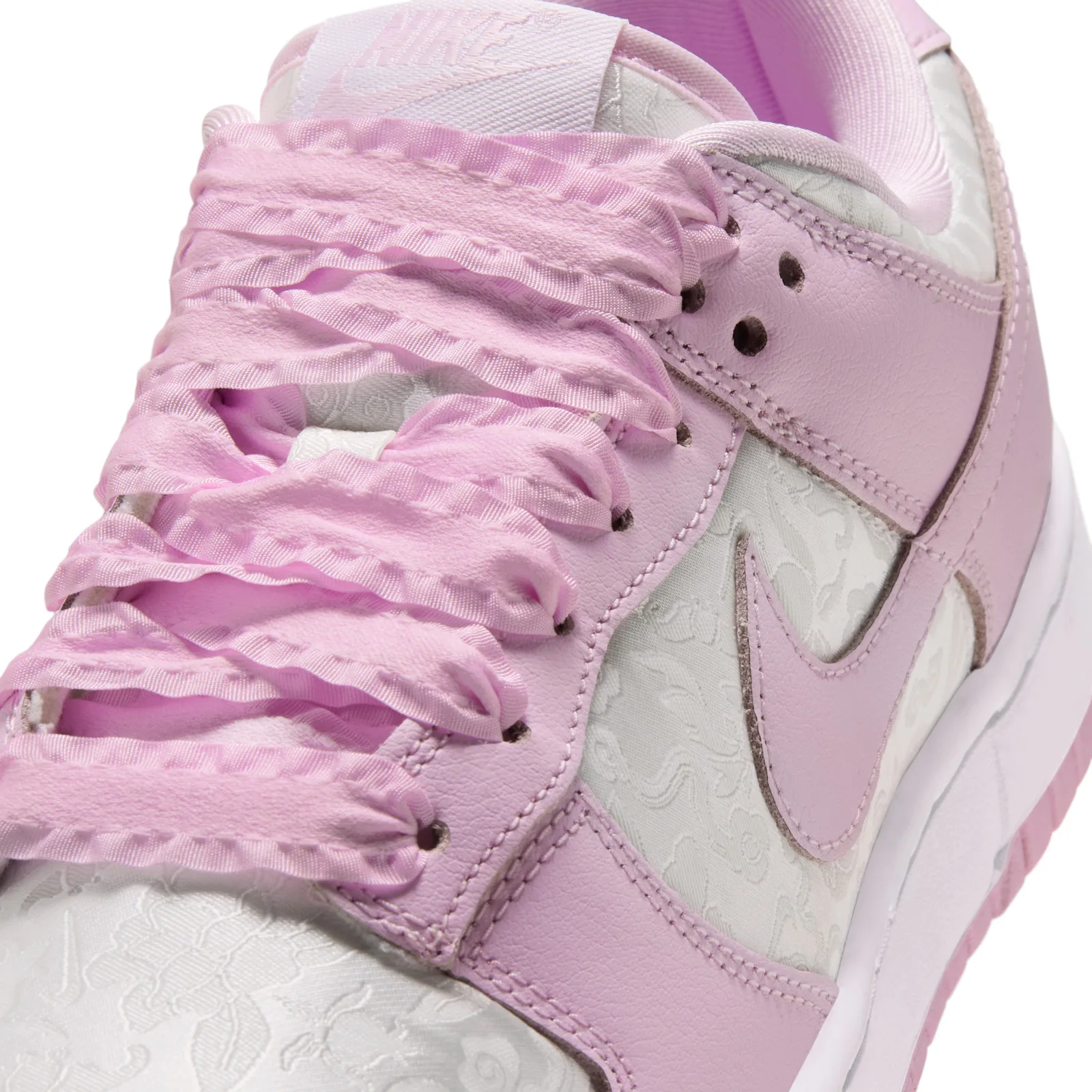 close-up toe and eyelets, pink laces through pink swoosh, Pink Foam