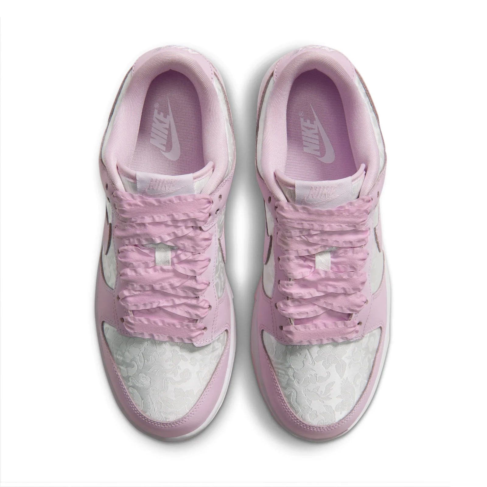 top-down pair view, pink laces, NIKE tongue tag, floral panels, Pink Foam