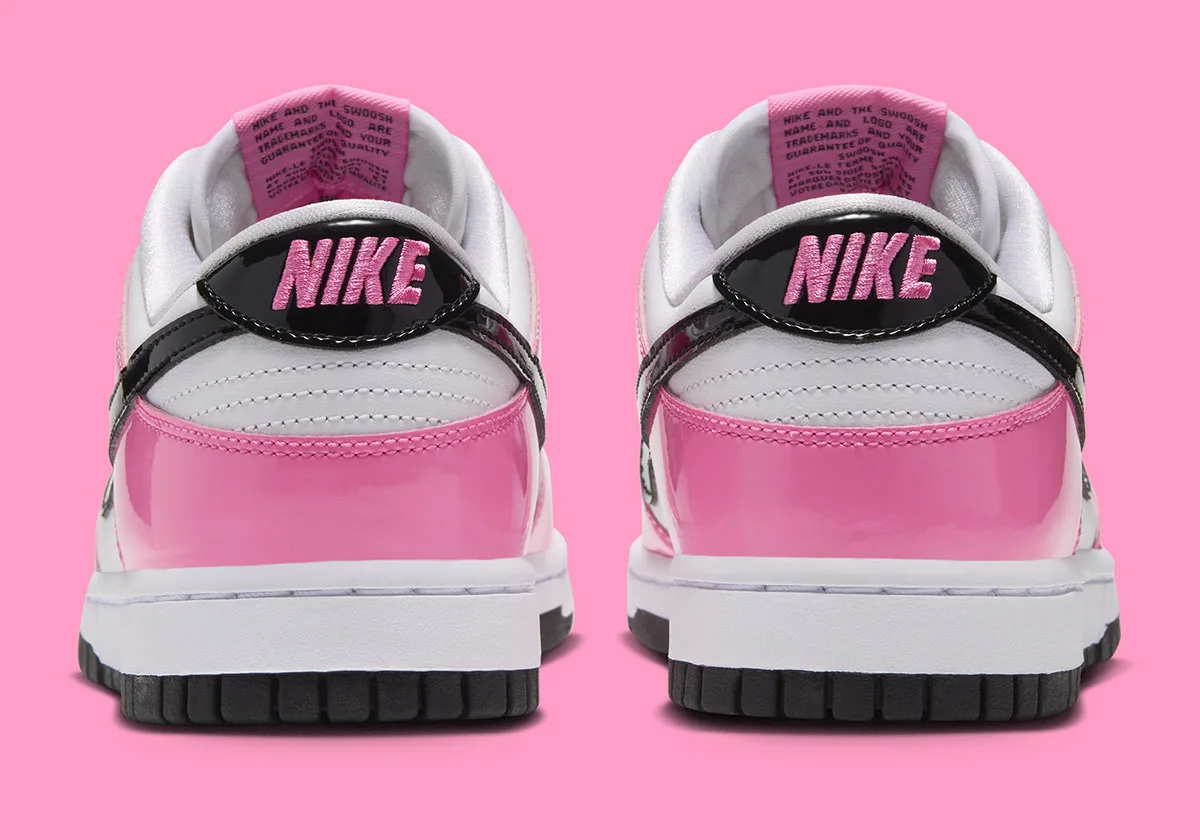 heel view of pair, pink patent overlay with black NIKE wing tab on white base, Pink Spell