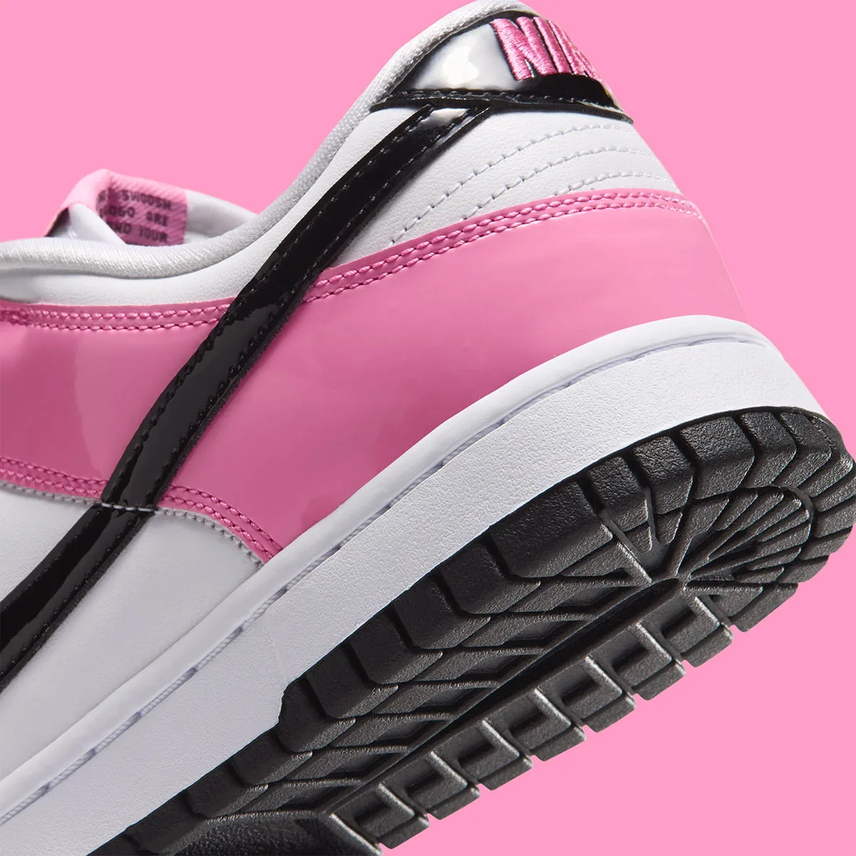 close-up heel and outsole, pink patent panel with black patent trim, Pink Spell
