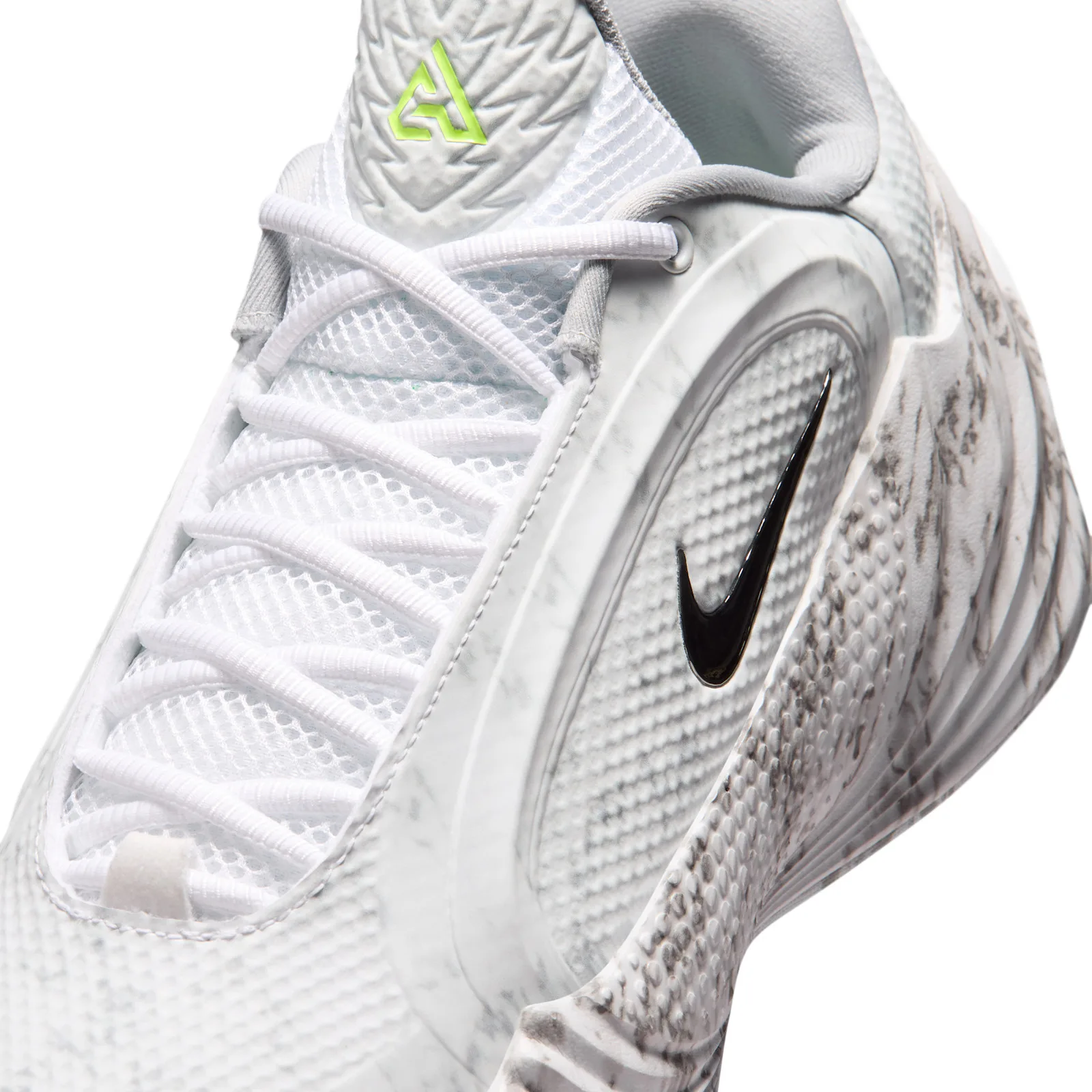 Close-up detail, black swoosh on marbled heel with volt logo tab above, Etched in Stone