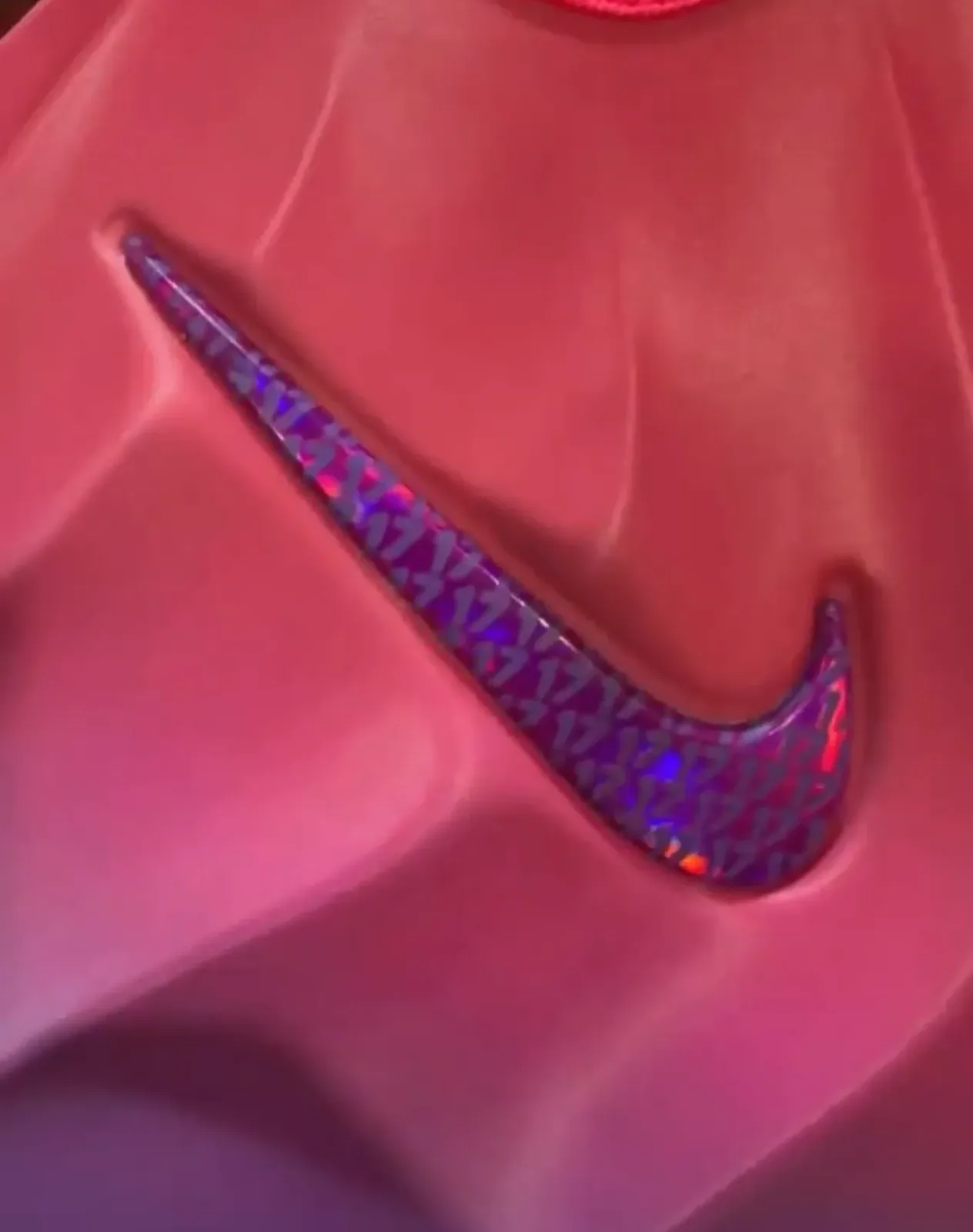 close-up of iridescent purple swoosh on pink textured upper, The Better Generation