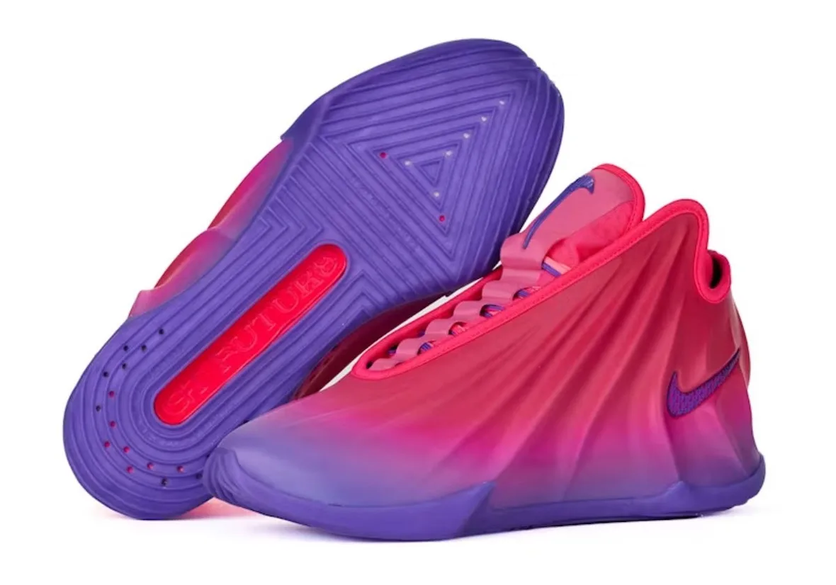 pair with one inverted shoe showing ridged purple outsole and red text, laced pink upper, The Better Generation