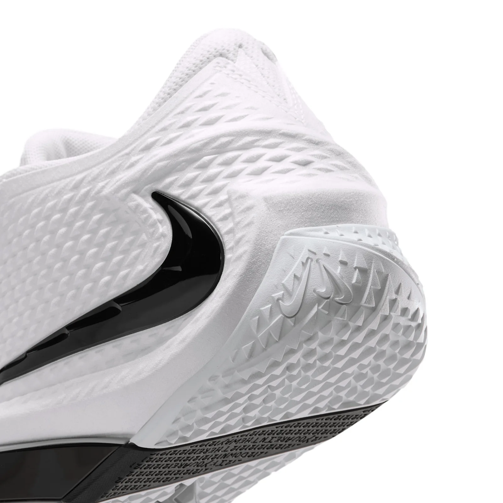 angled close-up of heel and outsole, black swoosh and textured tread, Phantom